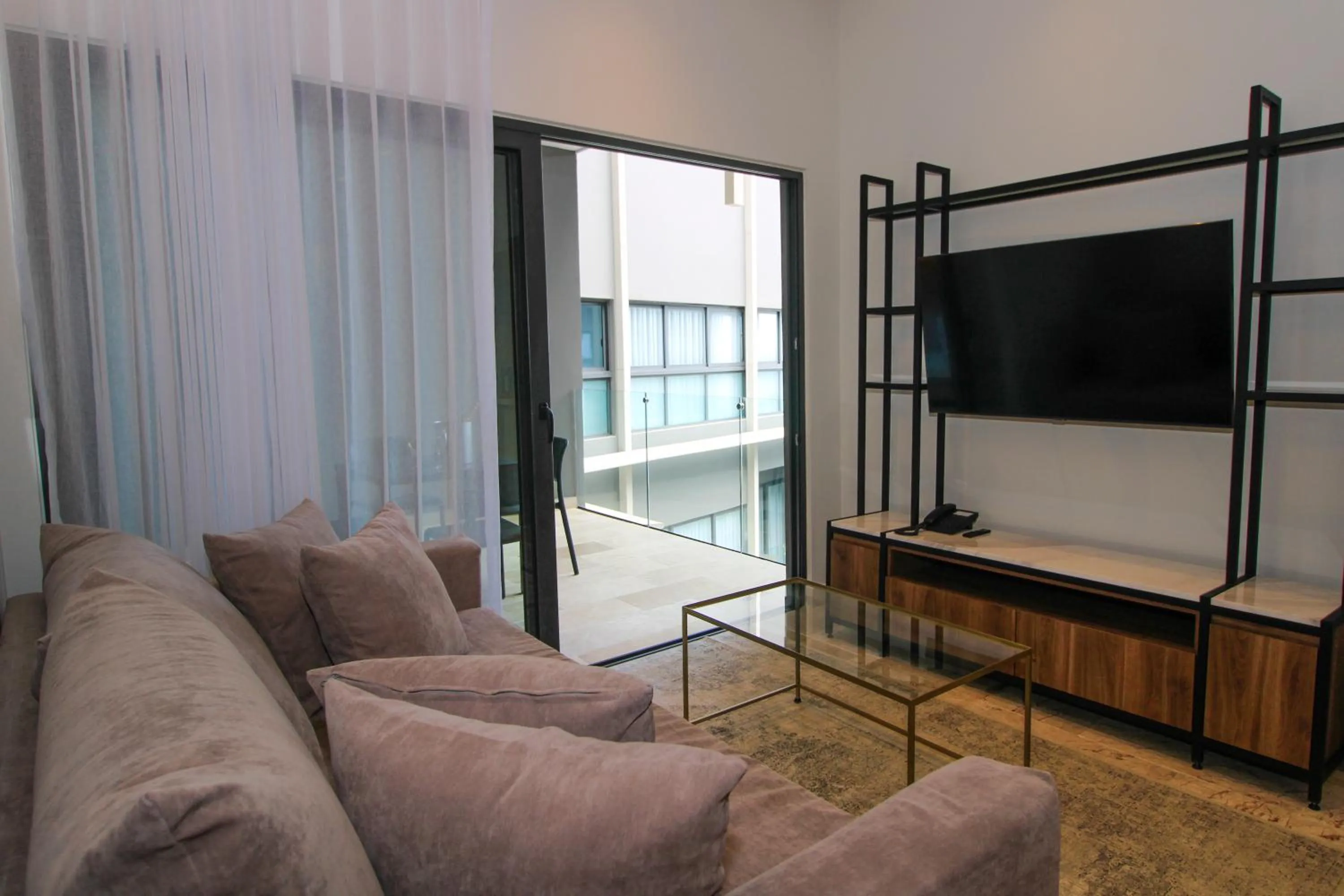 Communal lounge/ TV room in Singular Dream Vacation Rentals