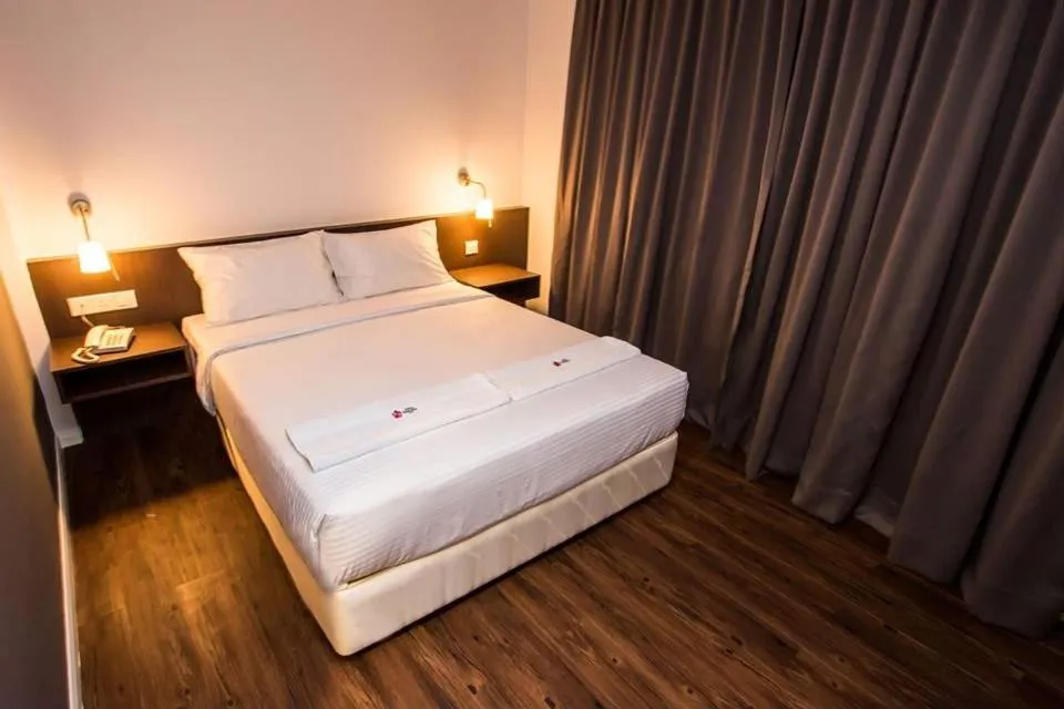 Bed in Sakura Boutique Hotel