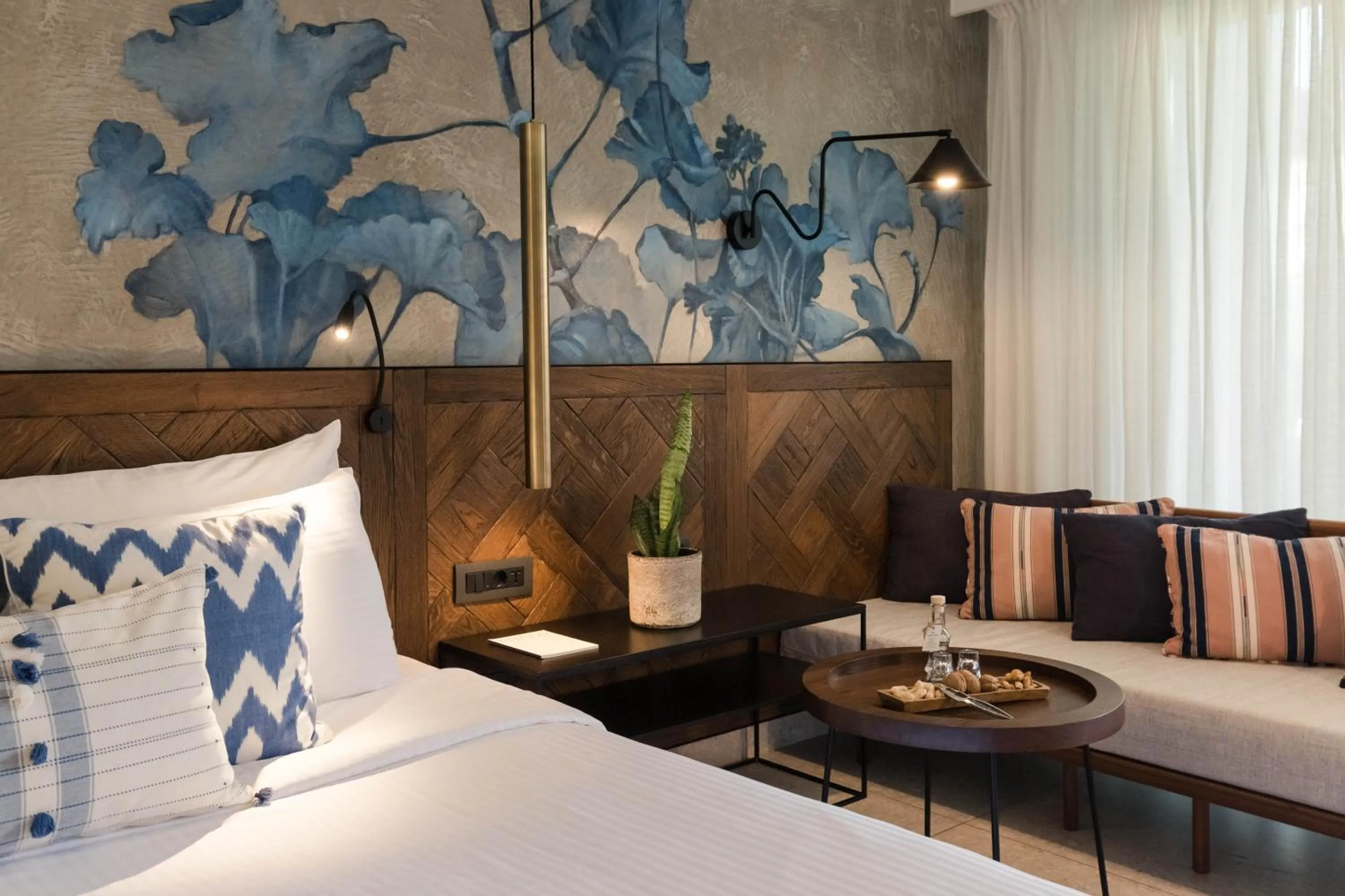 Living room, Bed in Phāea Cretan Malia, a Member of Design Hotels