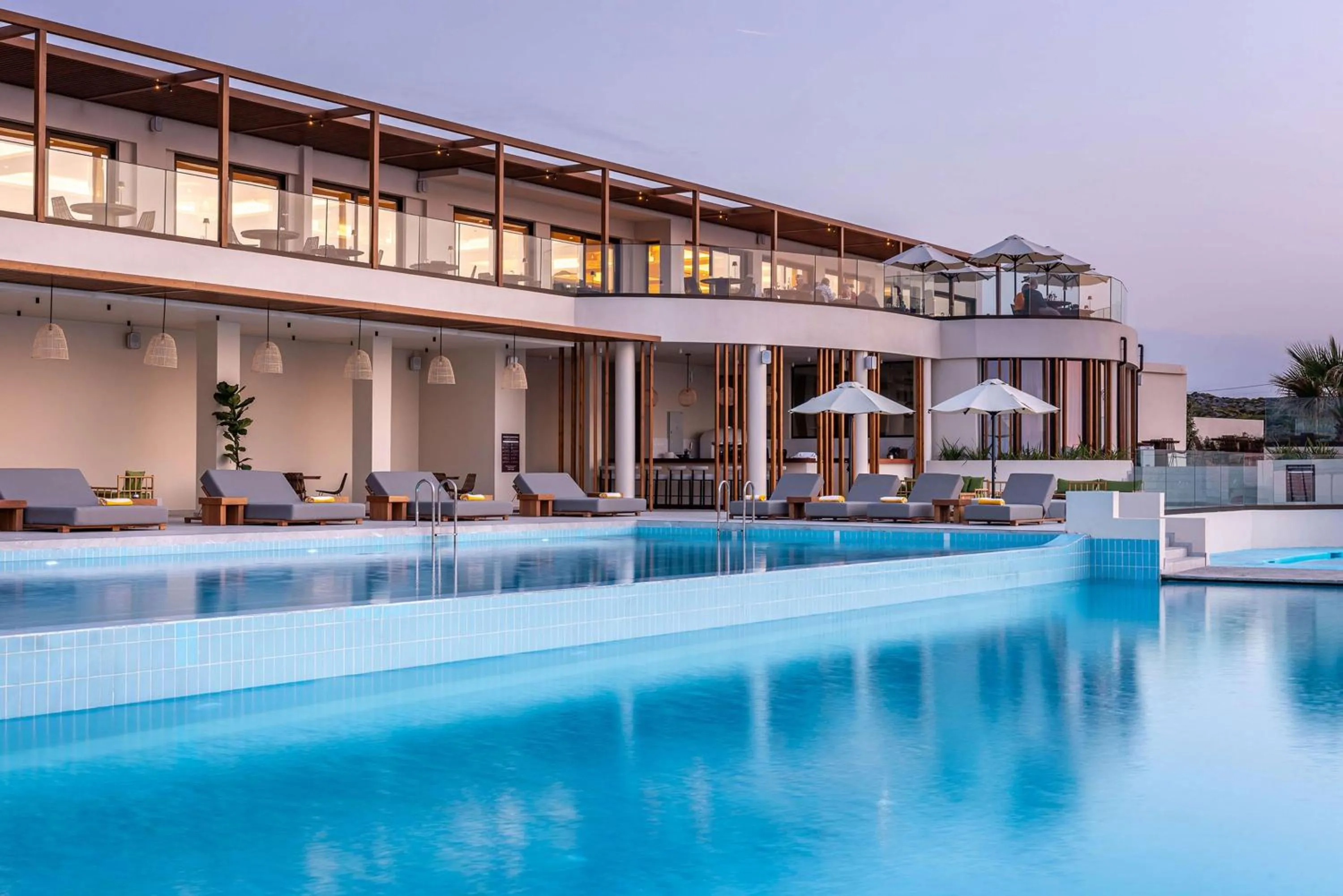 Pool view in Isla Brown Chania Resort, Curio Collection by Hilton