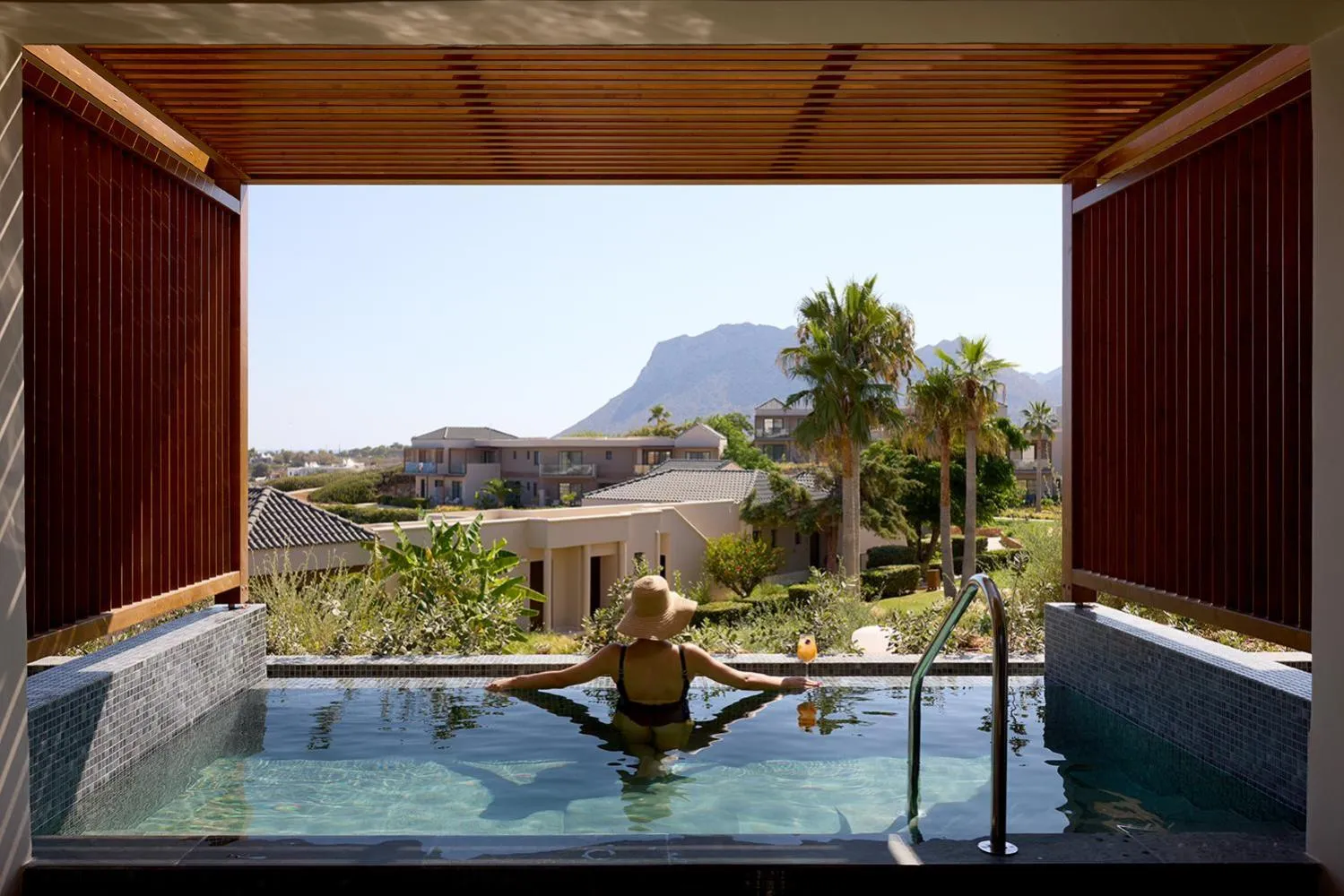 Pool view in Isla Brown Chania Resort, Curio Collection by Hilton