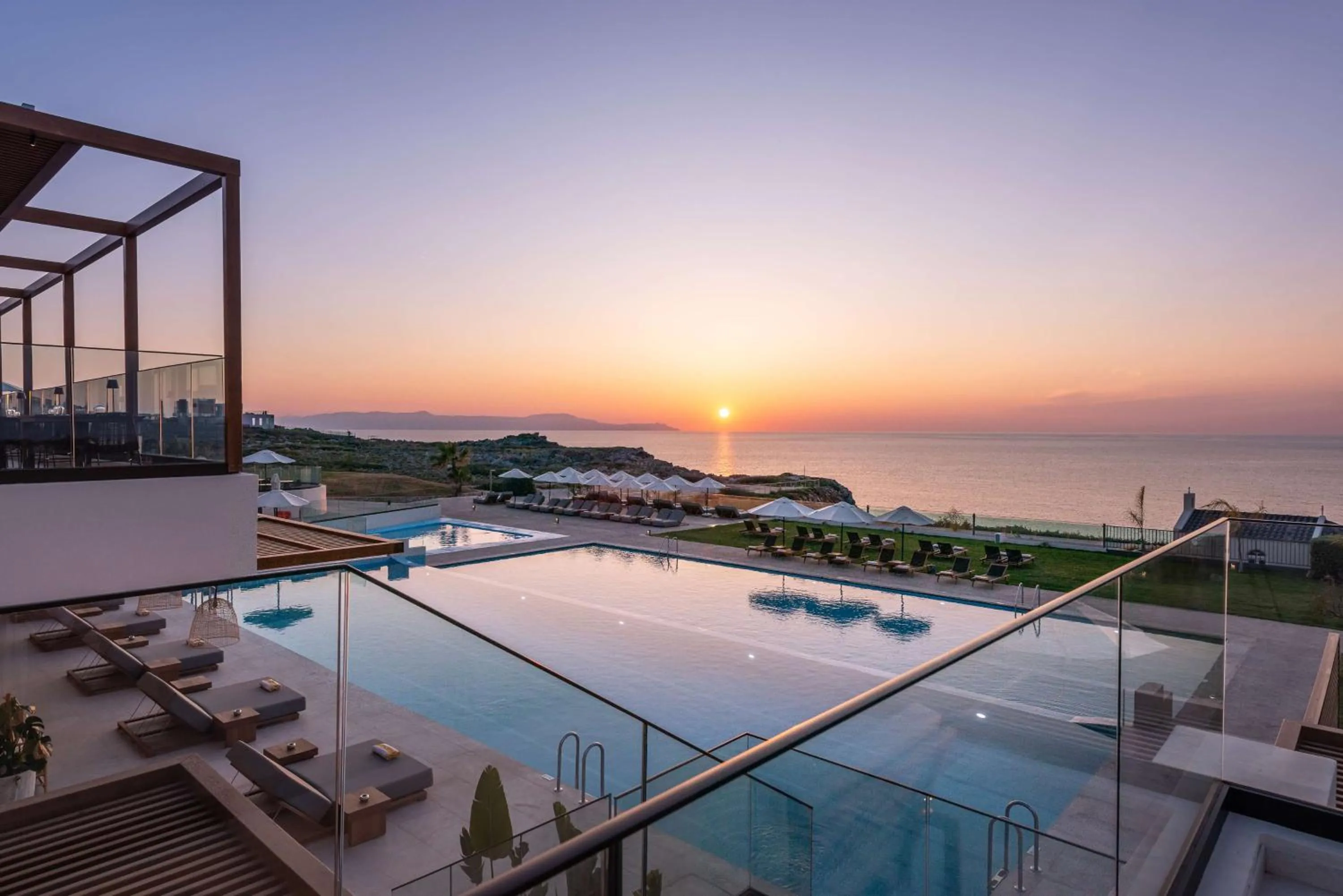 Pool view in Isla Brown Chania Resort, Curio Collection by Hilton