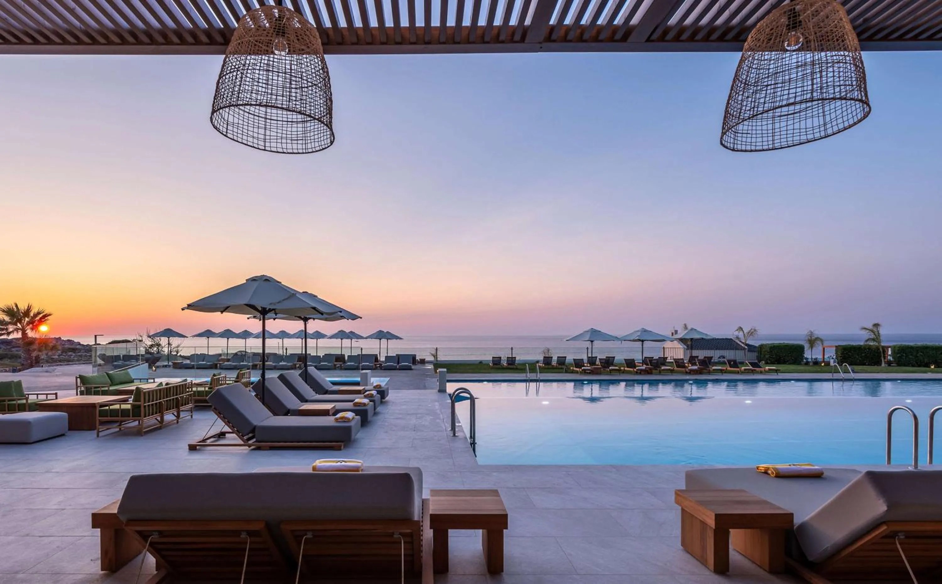 Pool view in Isla Brown Chania Resort, Curio Collection by Hilton