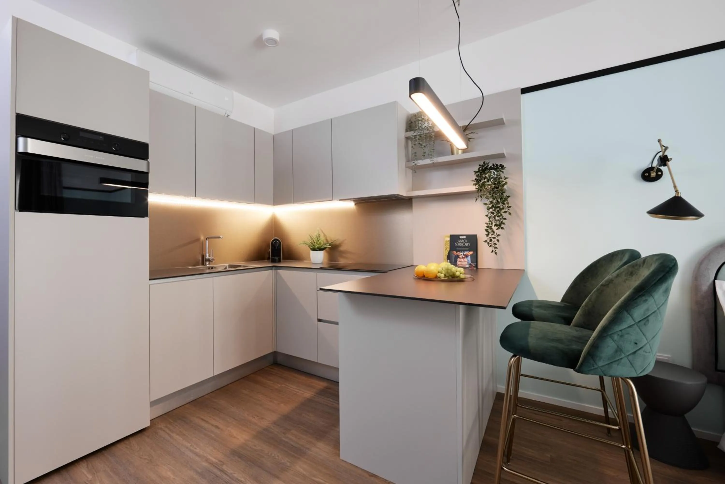Kitchen or kitchenette in The Amberlyn Suite Hotel