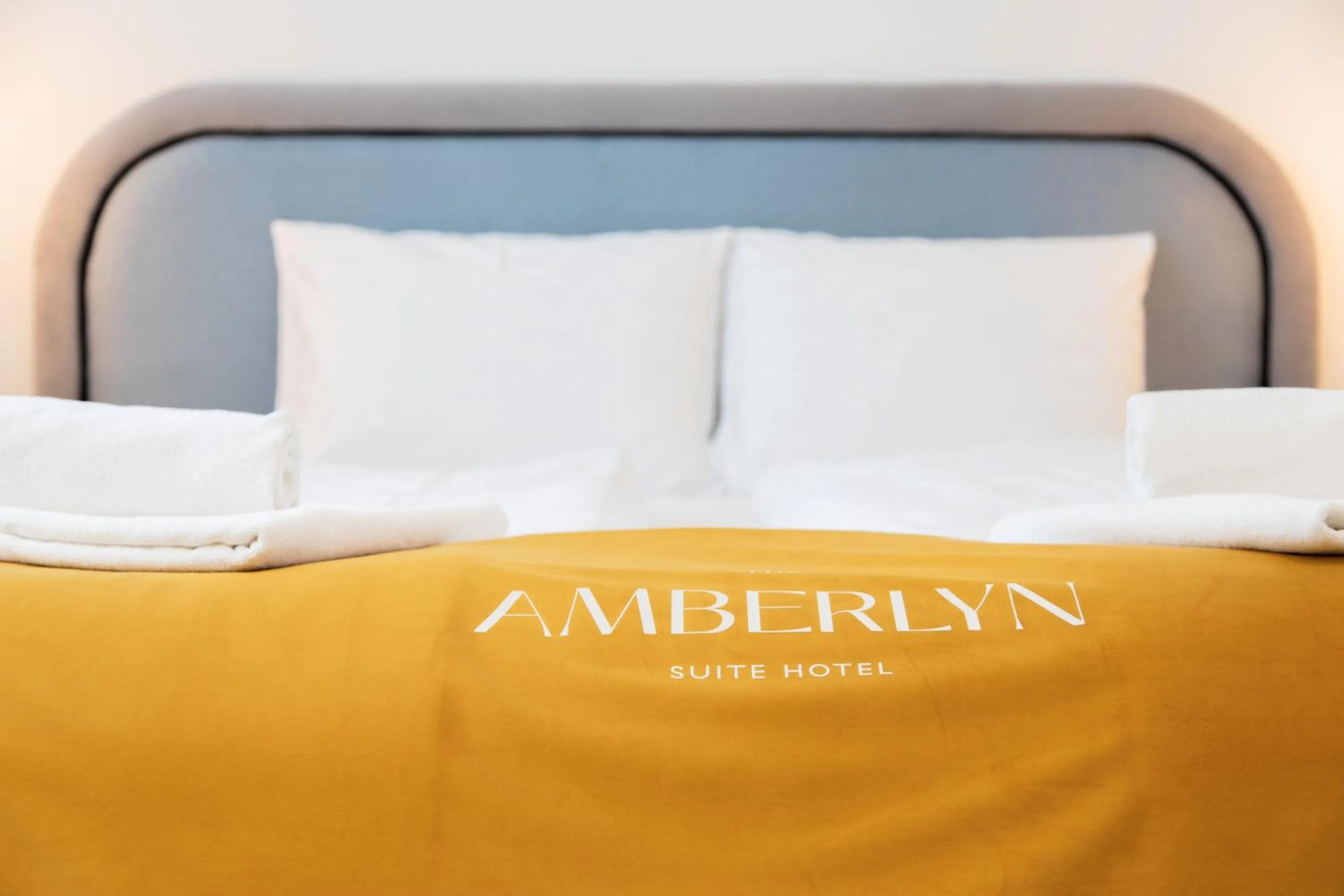 Bed in The Amberlyn Suite Hotel