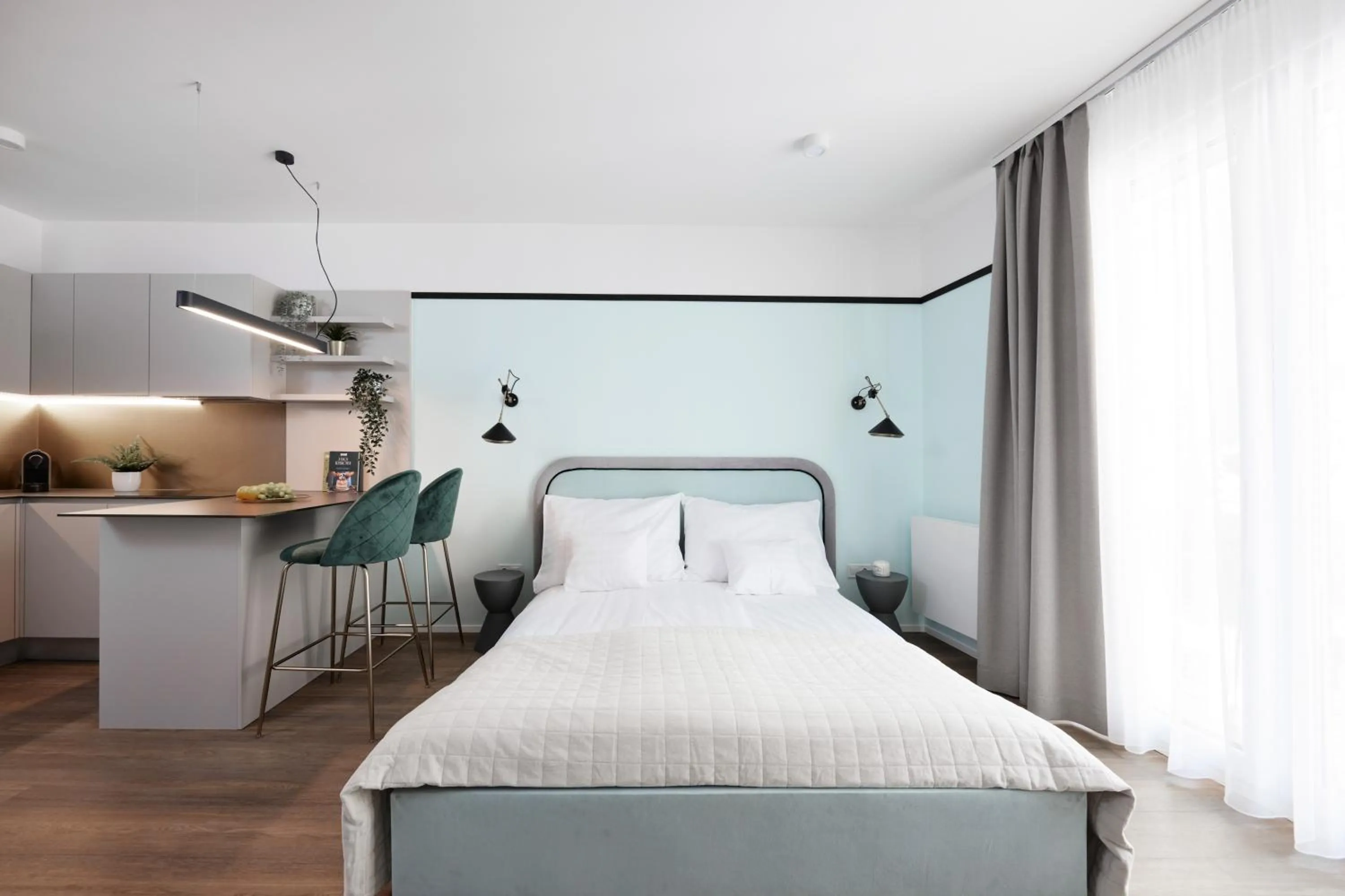 Bed in The Amberlyn Suite Hotel