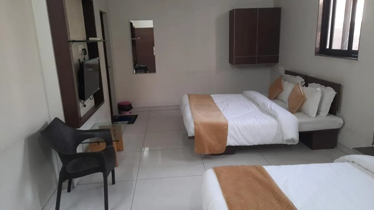 Bed in Indrani Hotel