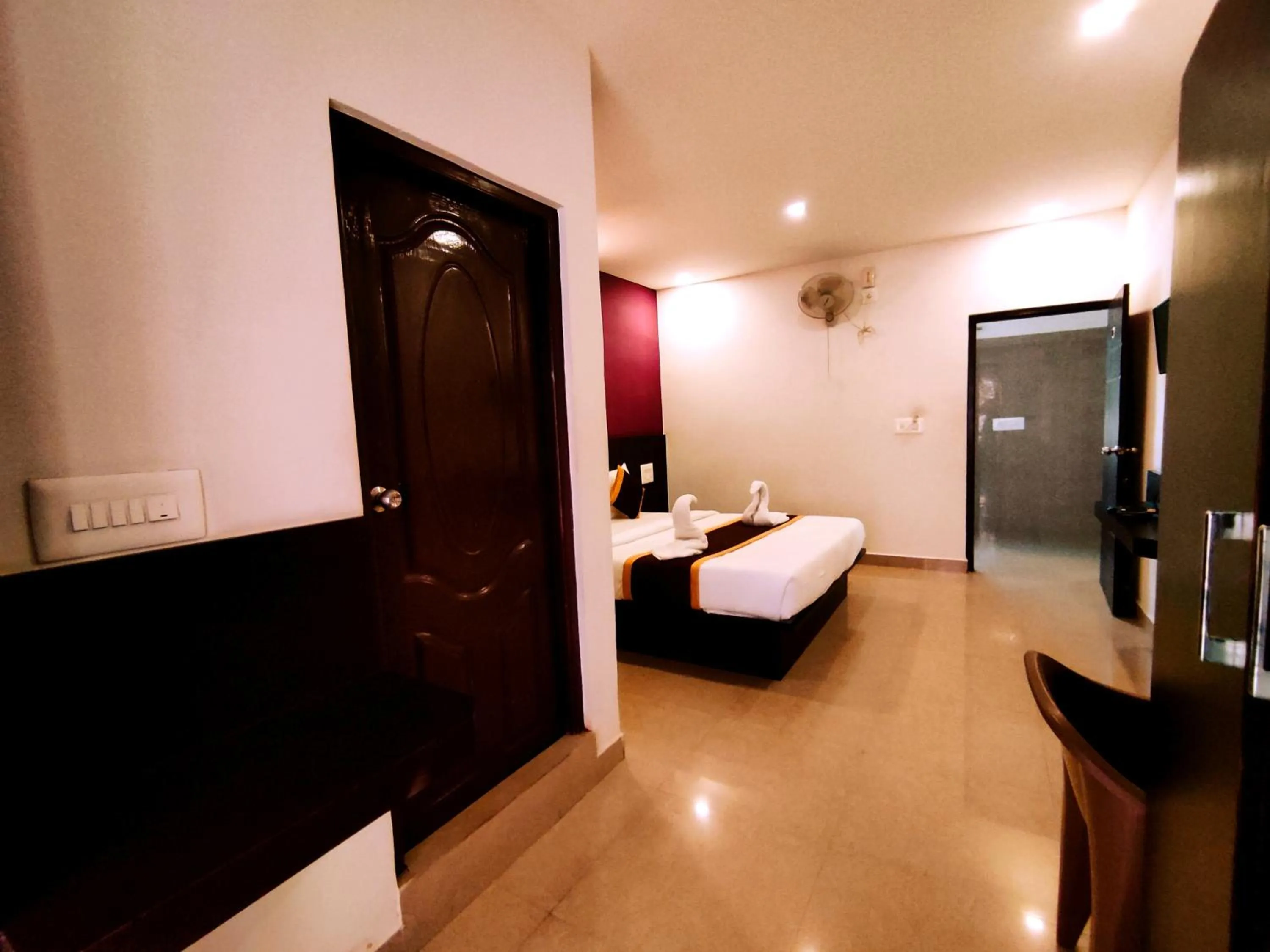 Seating area, Bed in Yuvraj Galaxy Inn