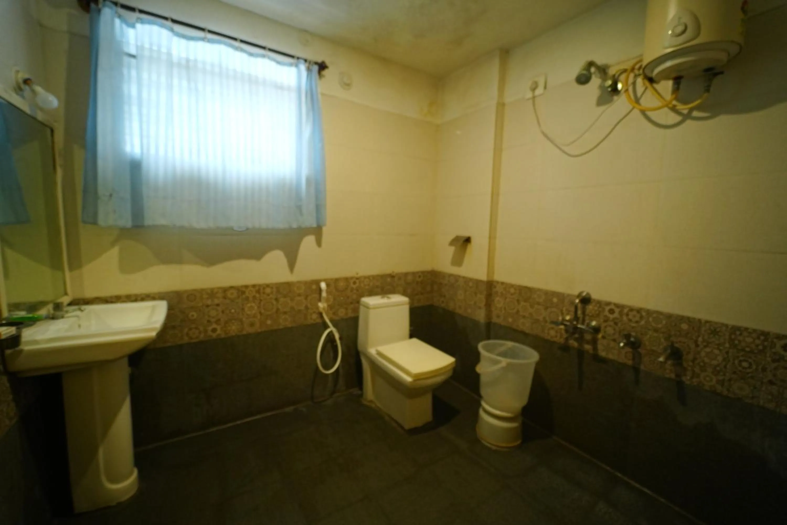 Bathroom in Yuvraj Galaxy Inn