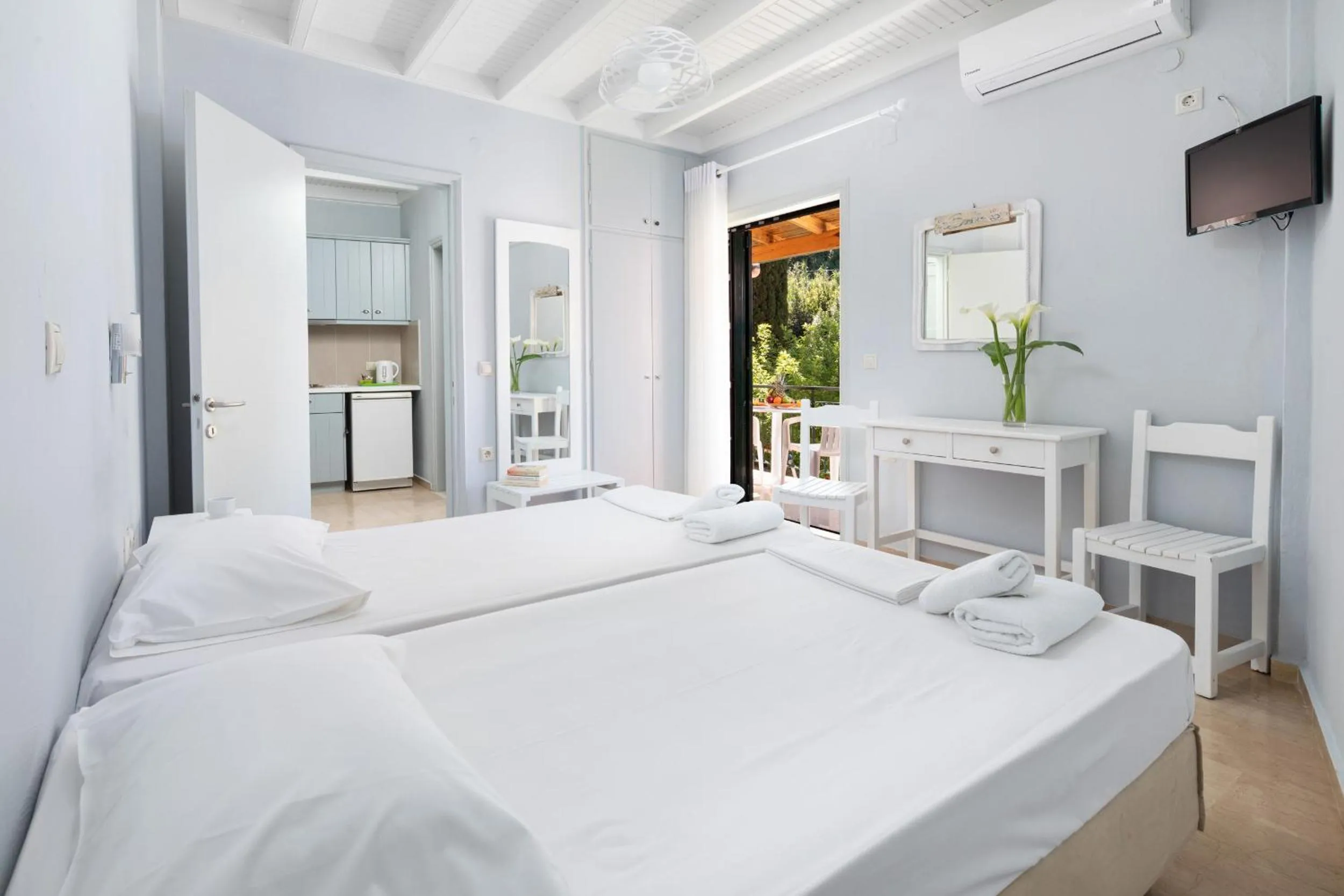 Bed in Bella Vista Beach Hotel