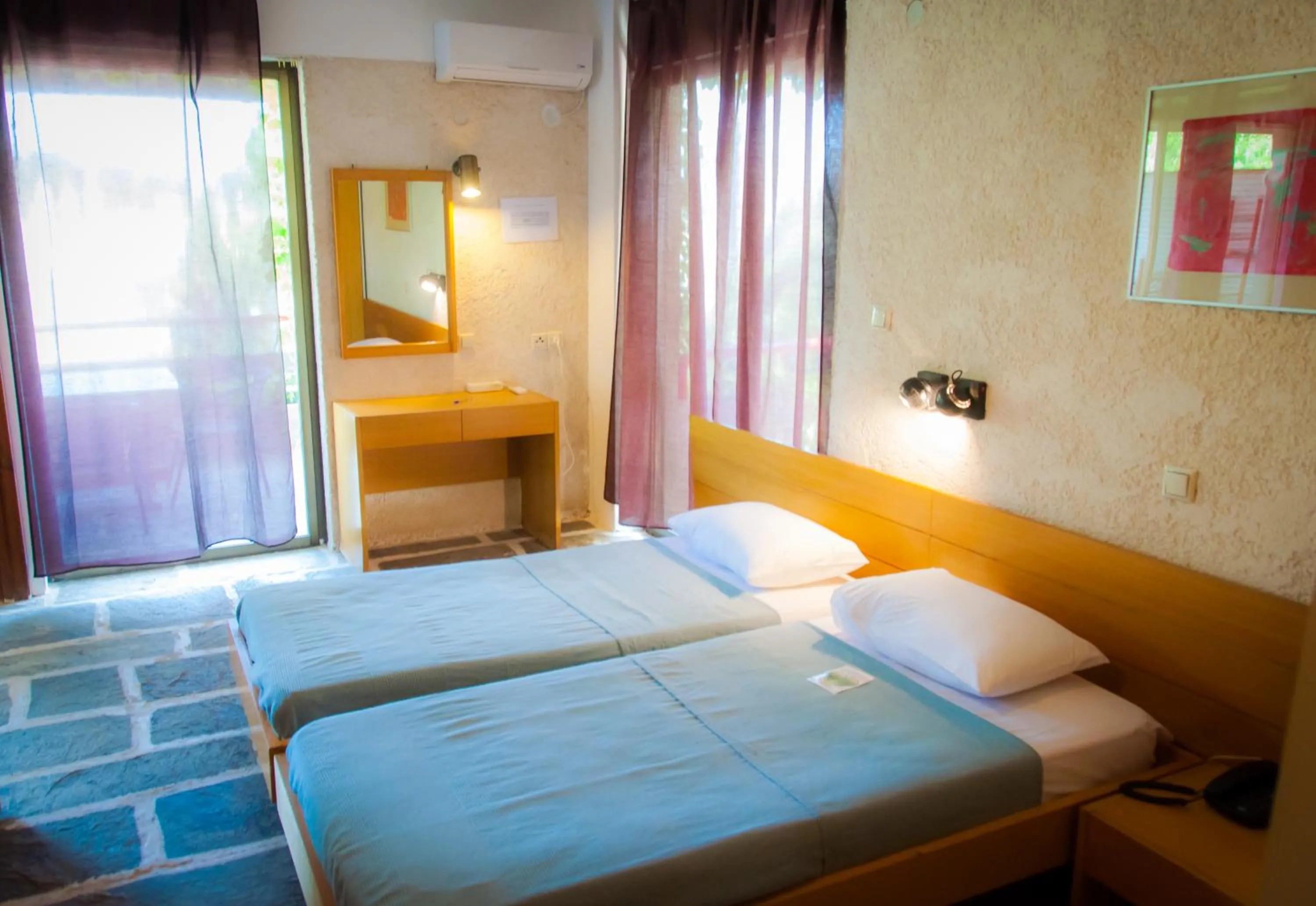 Bedroom in Apollonia Hotel Apartments