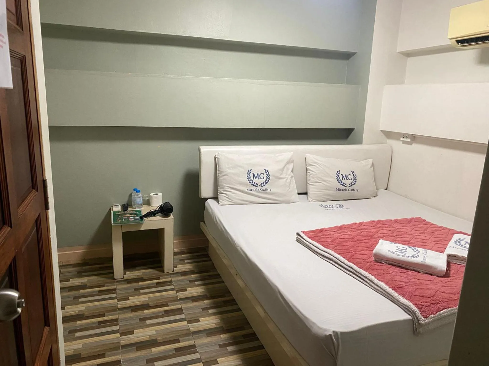 Bed in Miracle Gallery Hotel