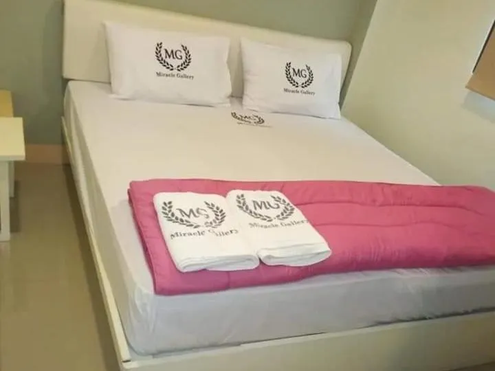 Bed in Miracle Gallery Hotel