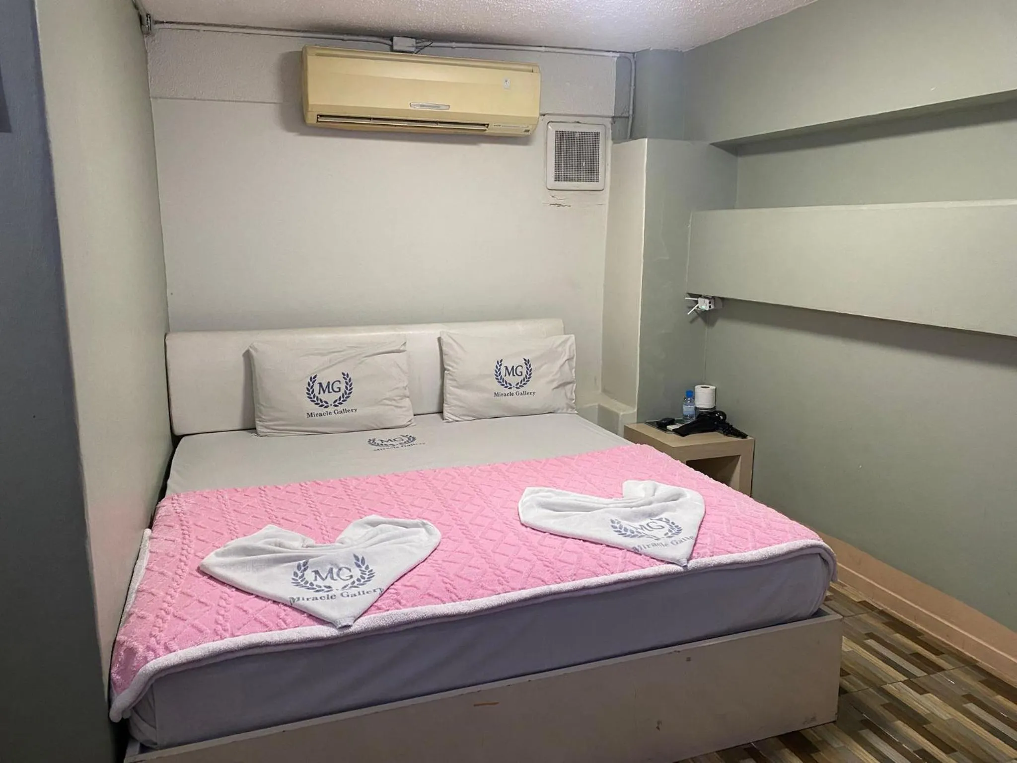 Bed in Miracle Gallery Hotel