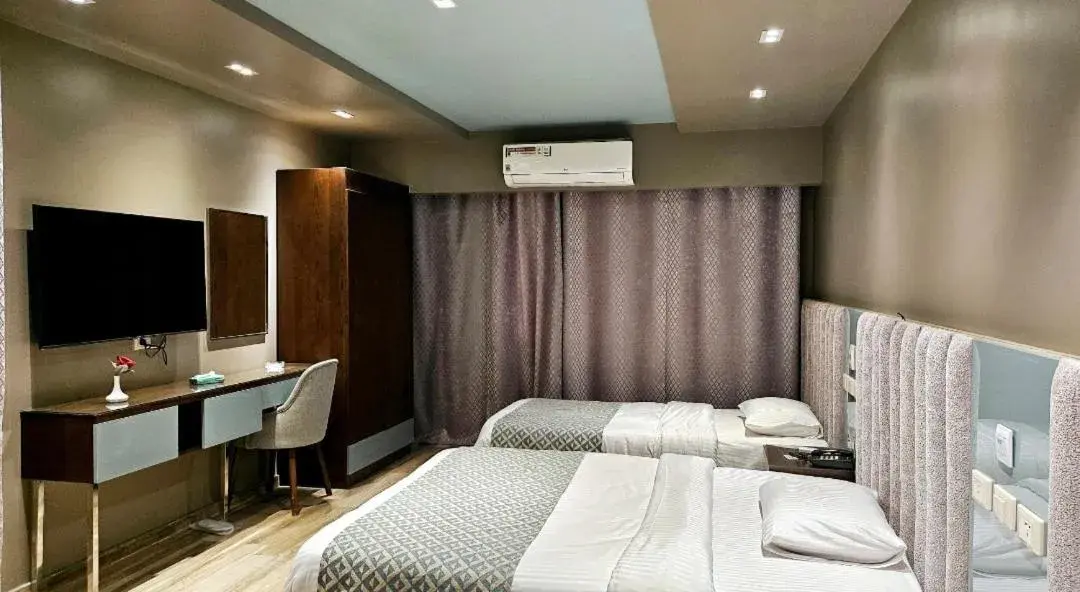 Family Room with Side Sea View in Grand Bayan Hotel & Apt at Nile Plaza Family Room with Side Sea View in Grand Bayan Hotel & Apt at Nile Plaza