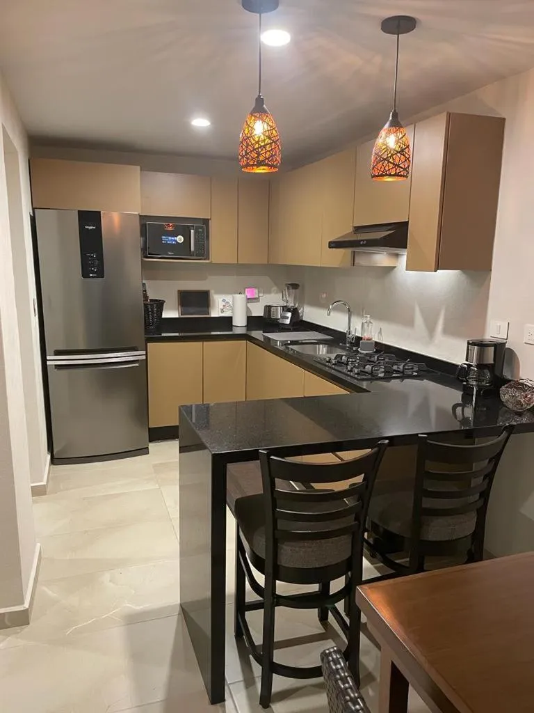 Kitchen or kitchenette in Departamento Céntrico y Moderno en Cancún.