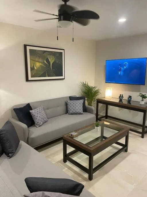 Living room in Departamento Céntrico y Moderno en Cancún.