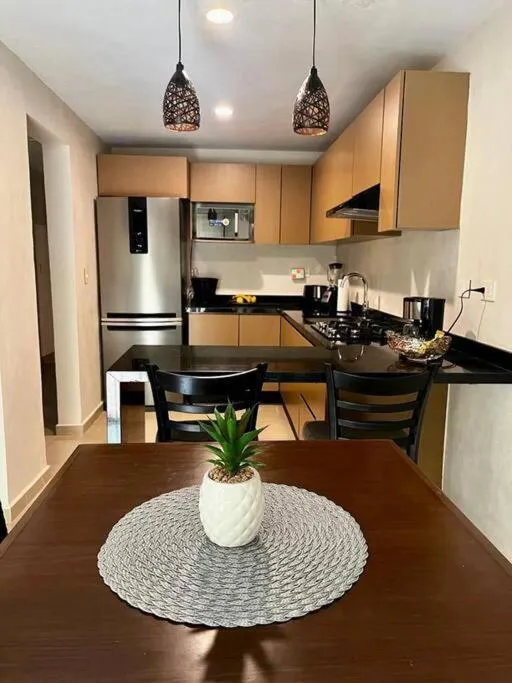 Kitchen or kitchenette in Departamento Céntrico y Moderno en Cancún.