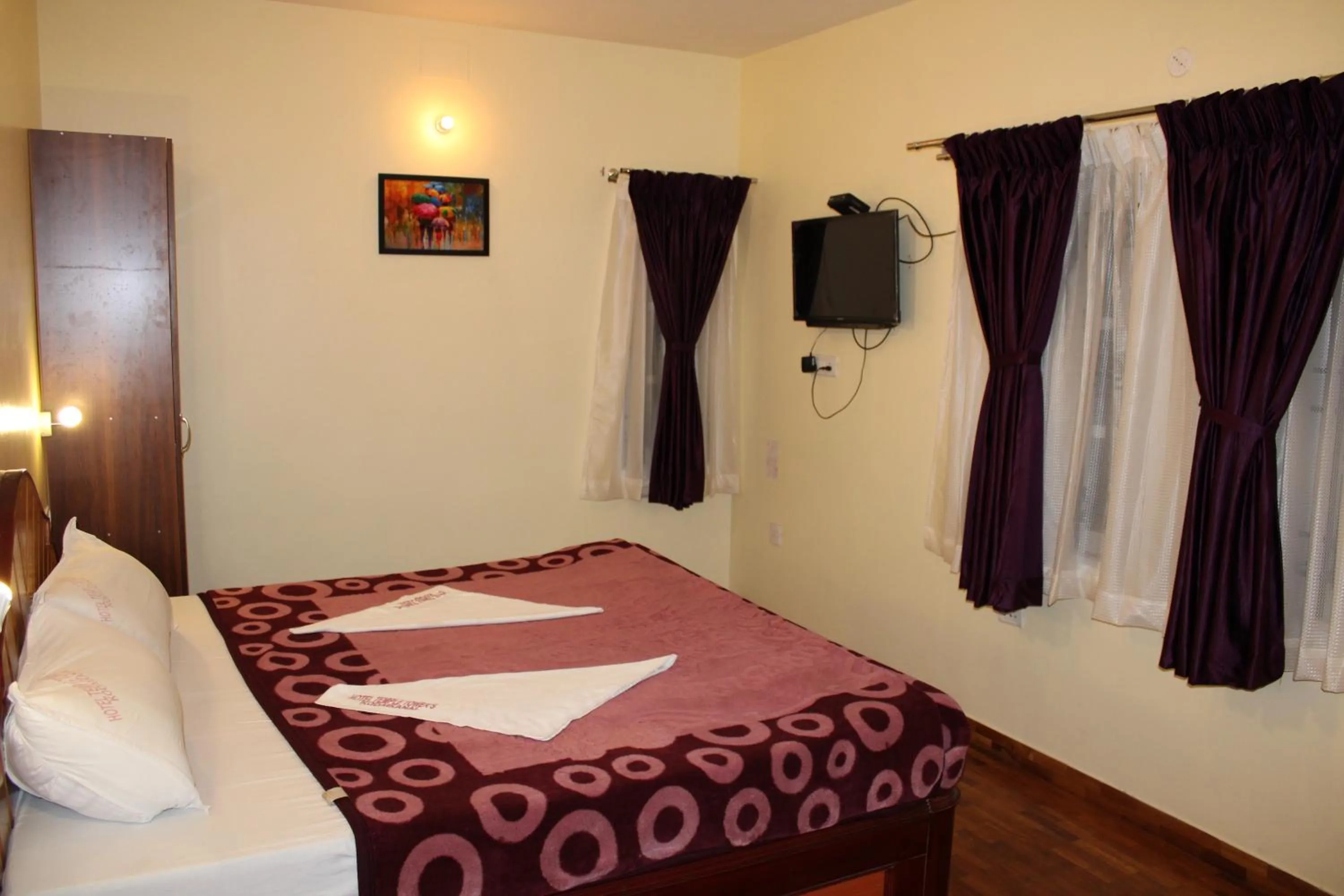 Bed in Hotel Temple Towers