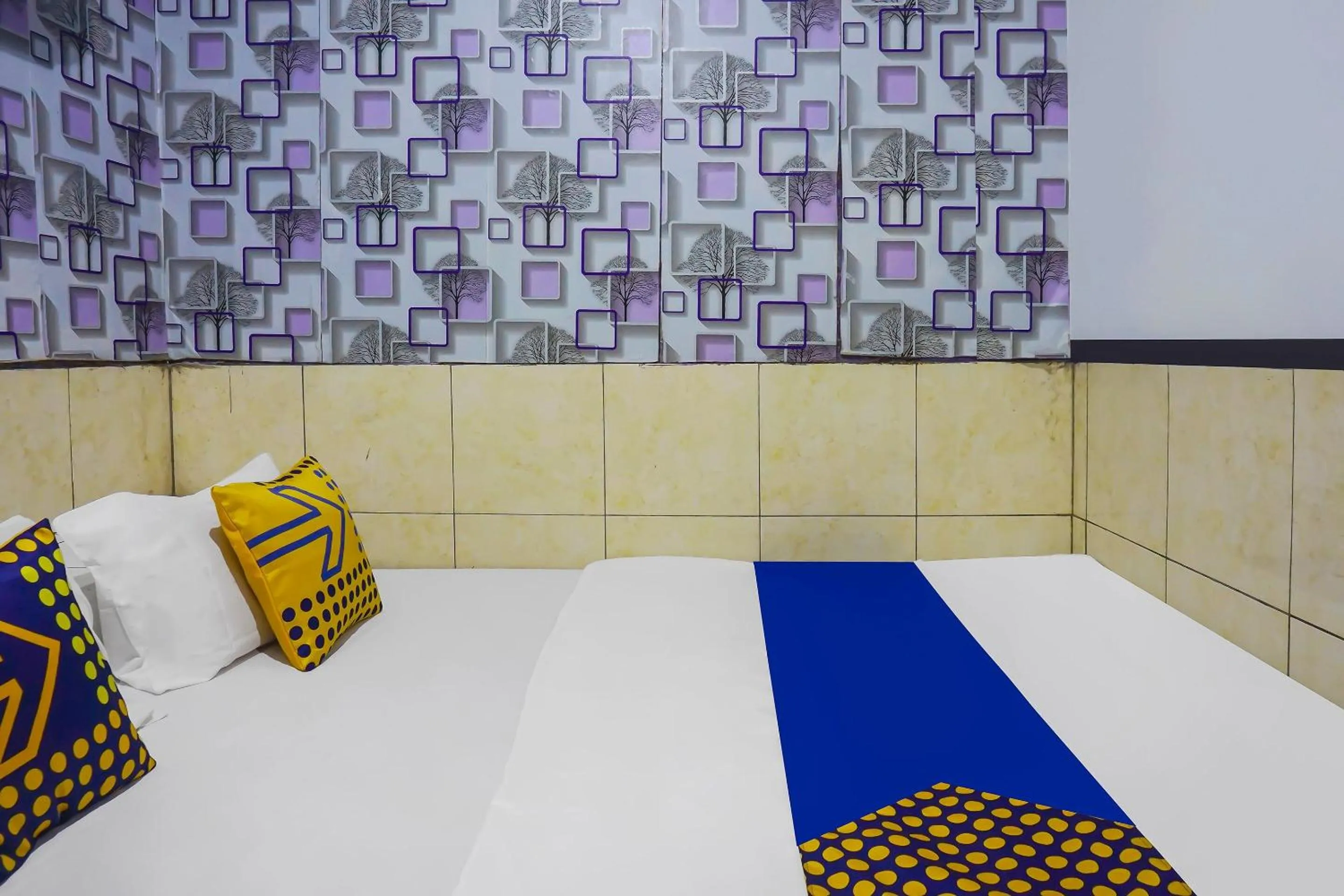 Bedroom in Hotel O Nusasari Guest House