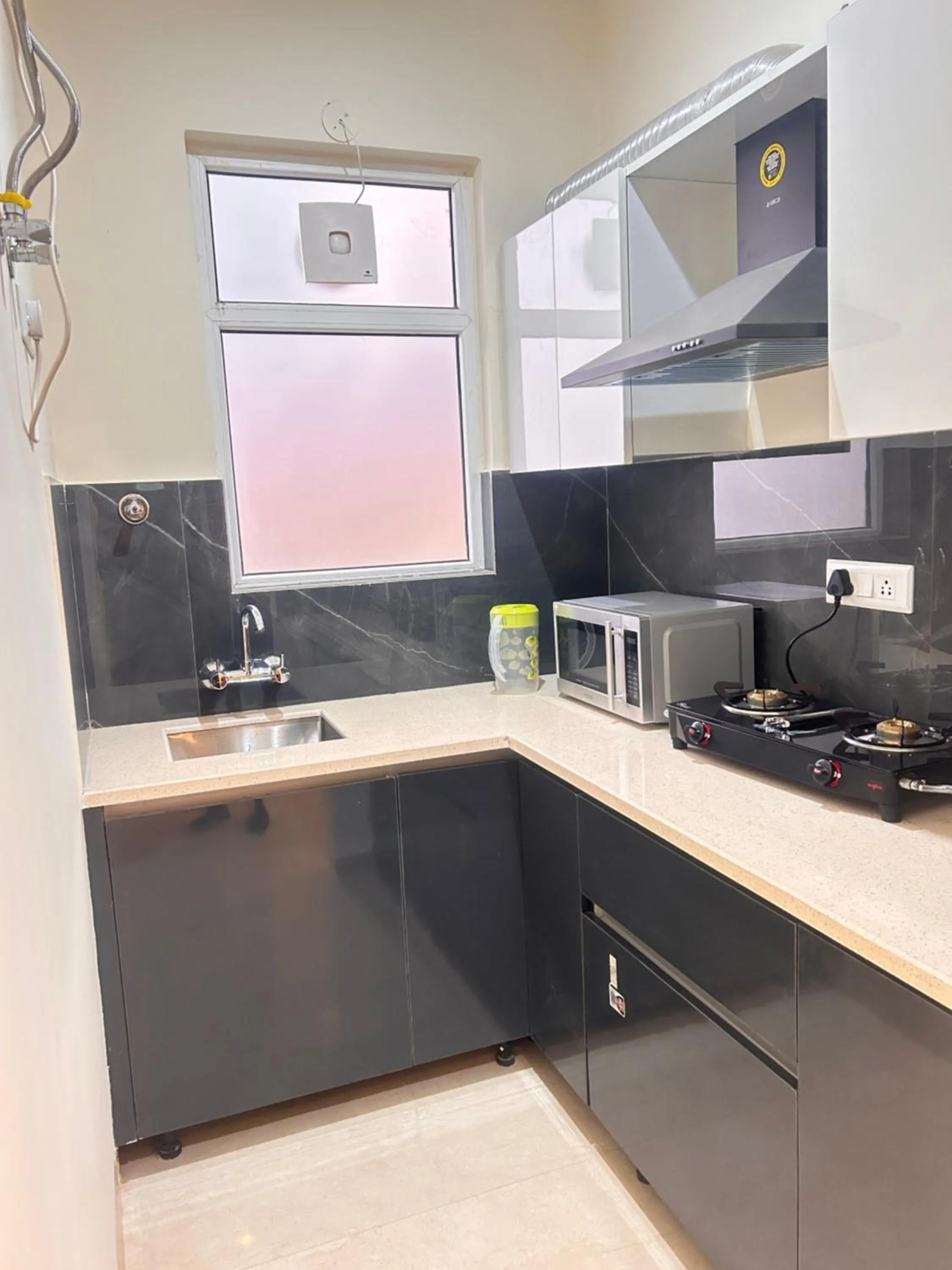 kitchen in Lime Tree 1BHK Serviced Apartment - Medanta Medicity, Gurgaon