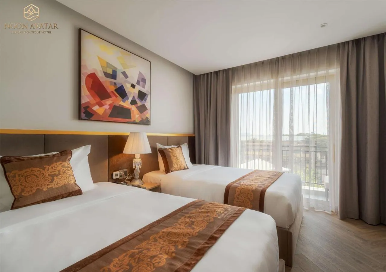 Bed in Ngon Avatar Hotel