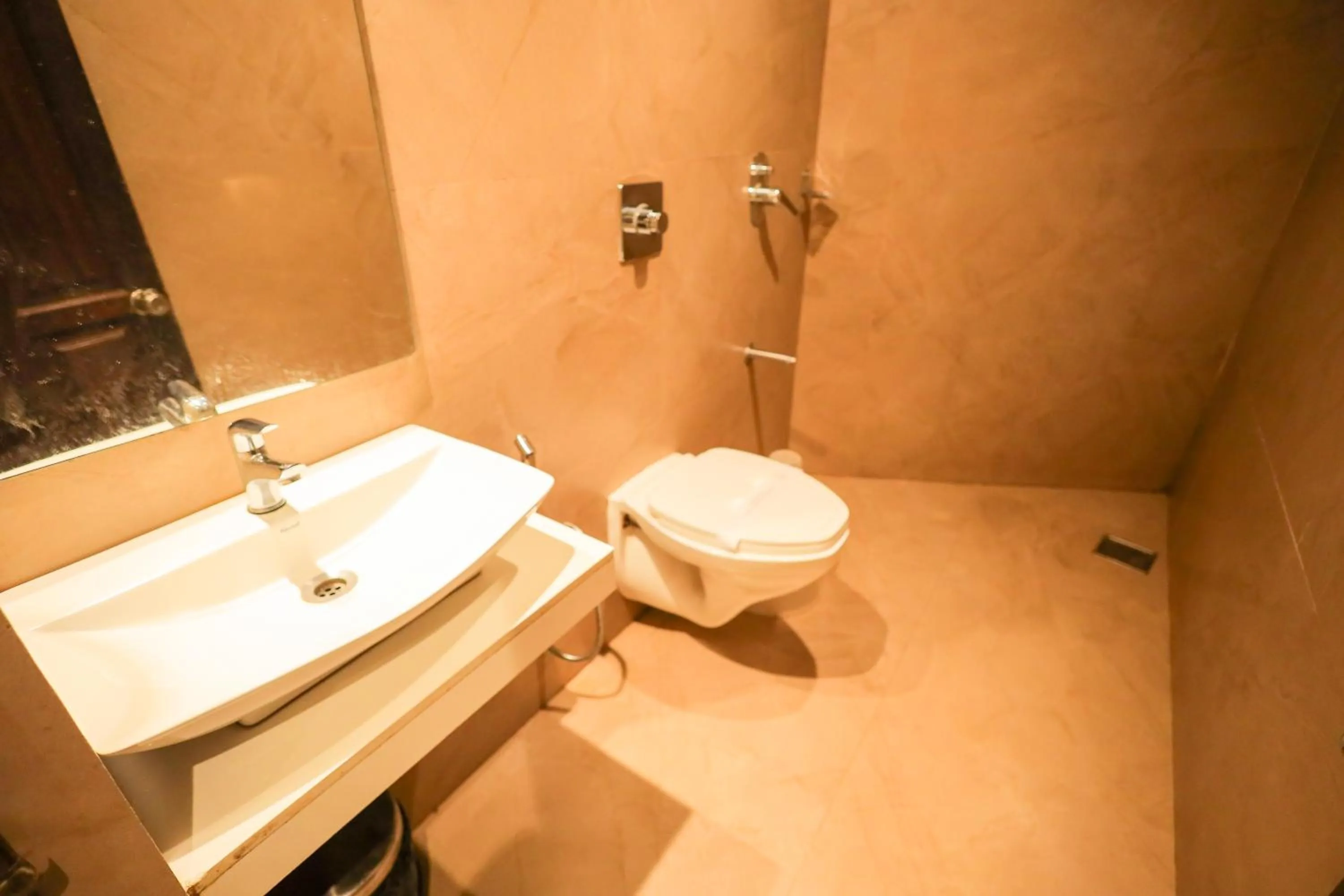 Bathroom in Hotel Plaza Heights by RAK Rooms, Mangaluru