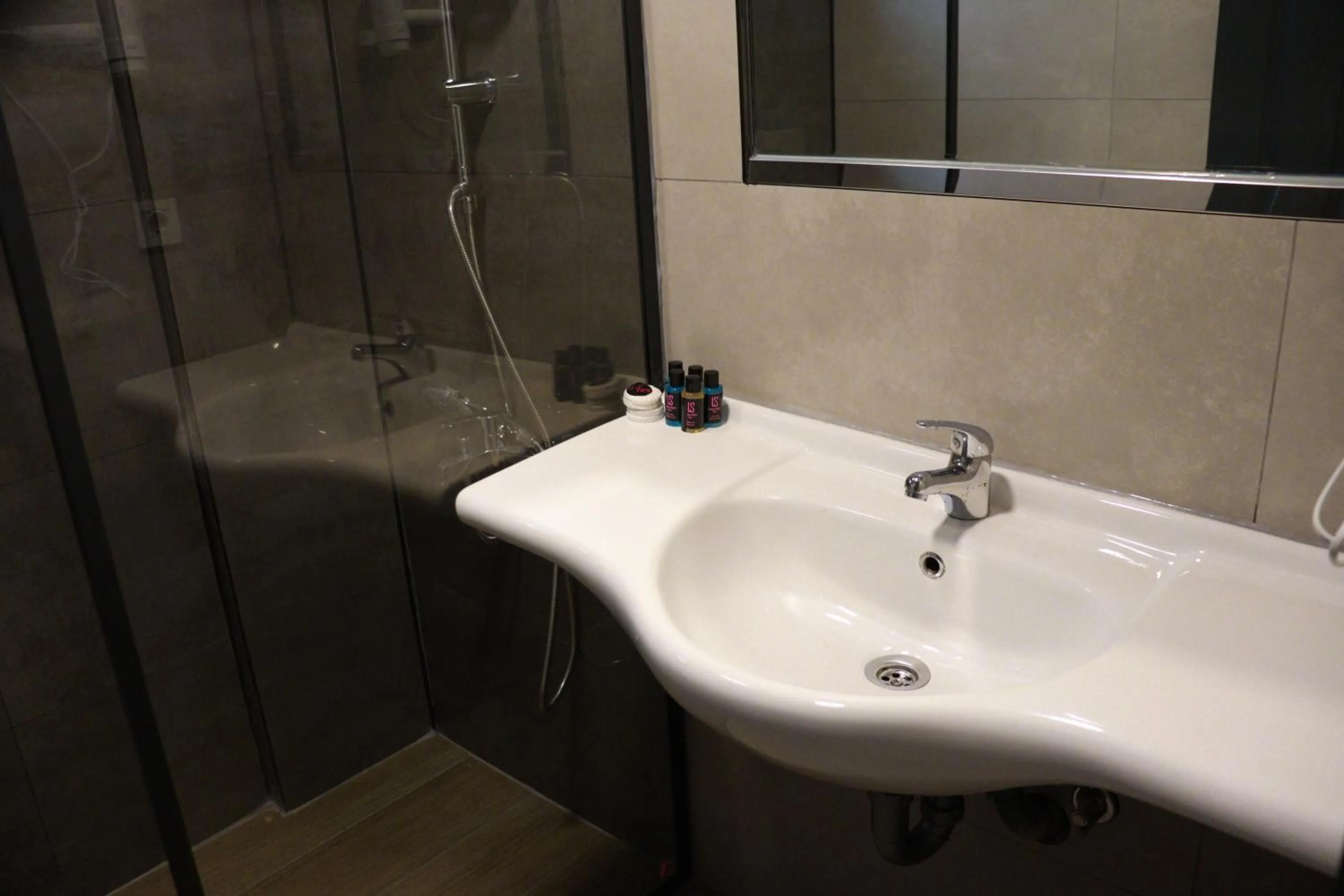 Bathroom in LEMAS SUITE HOTEL