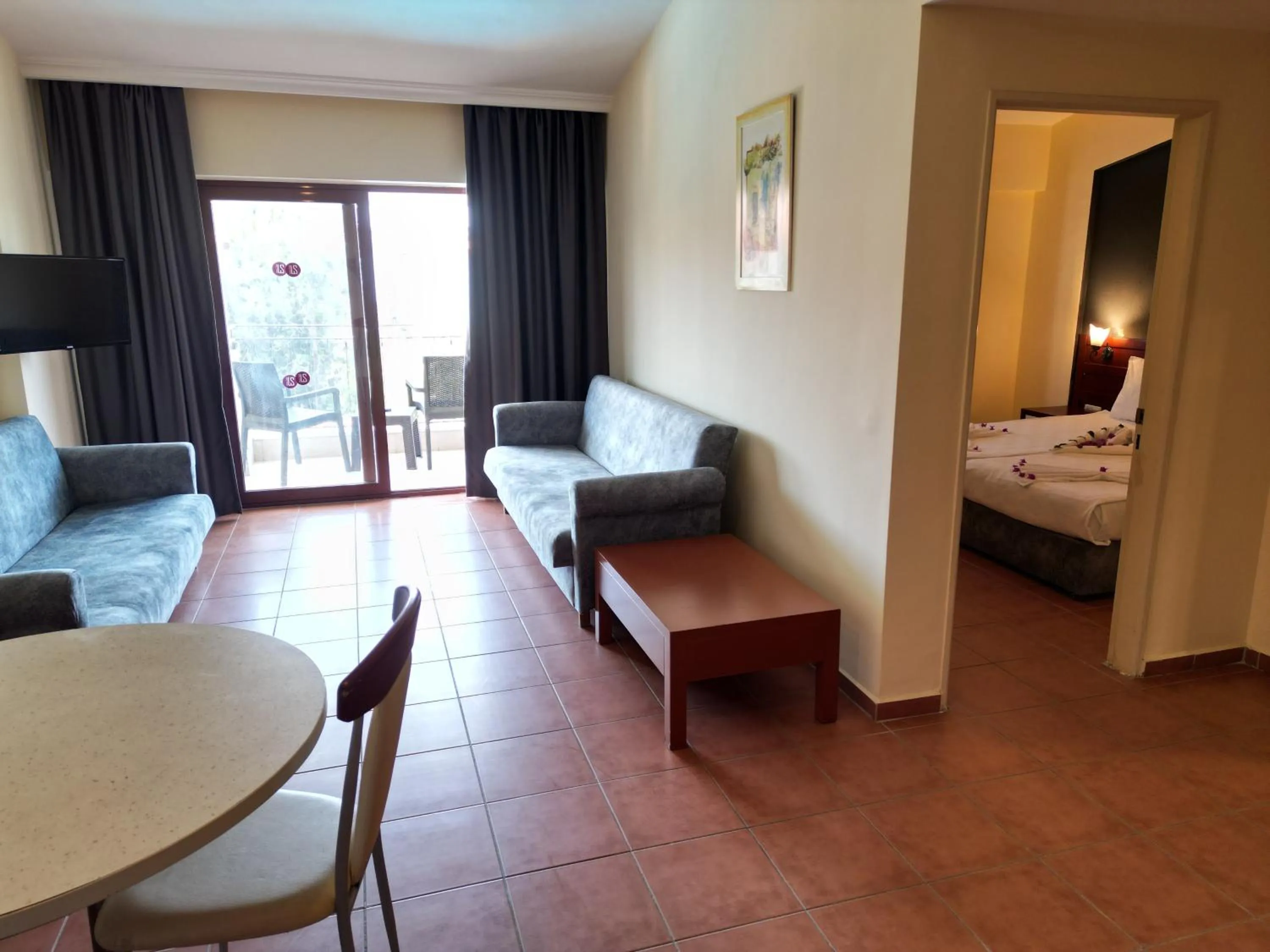 Bed in LEMAS SUITE HOTEL