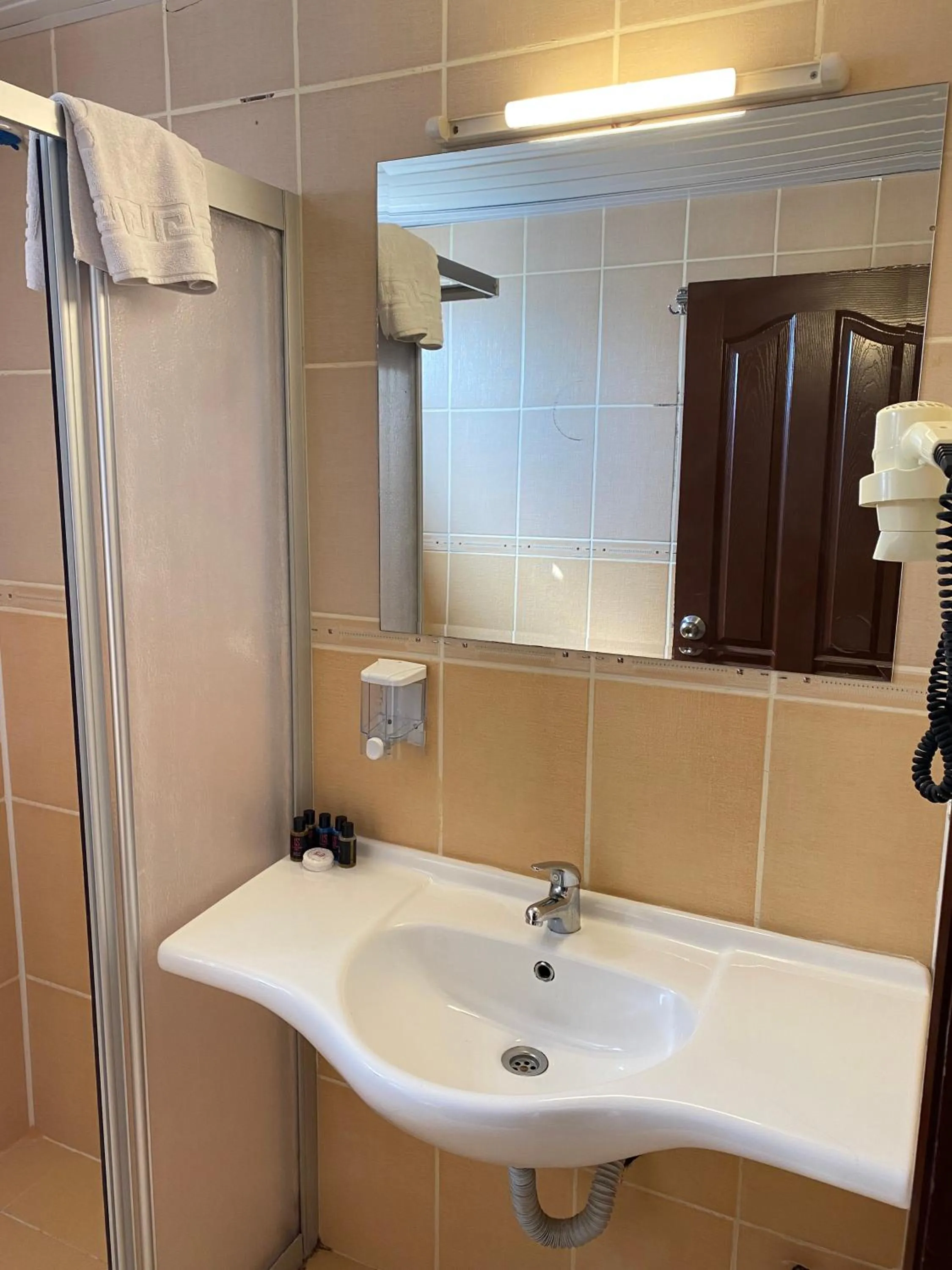 Bathroom in LEMAS SUITE HOTEL