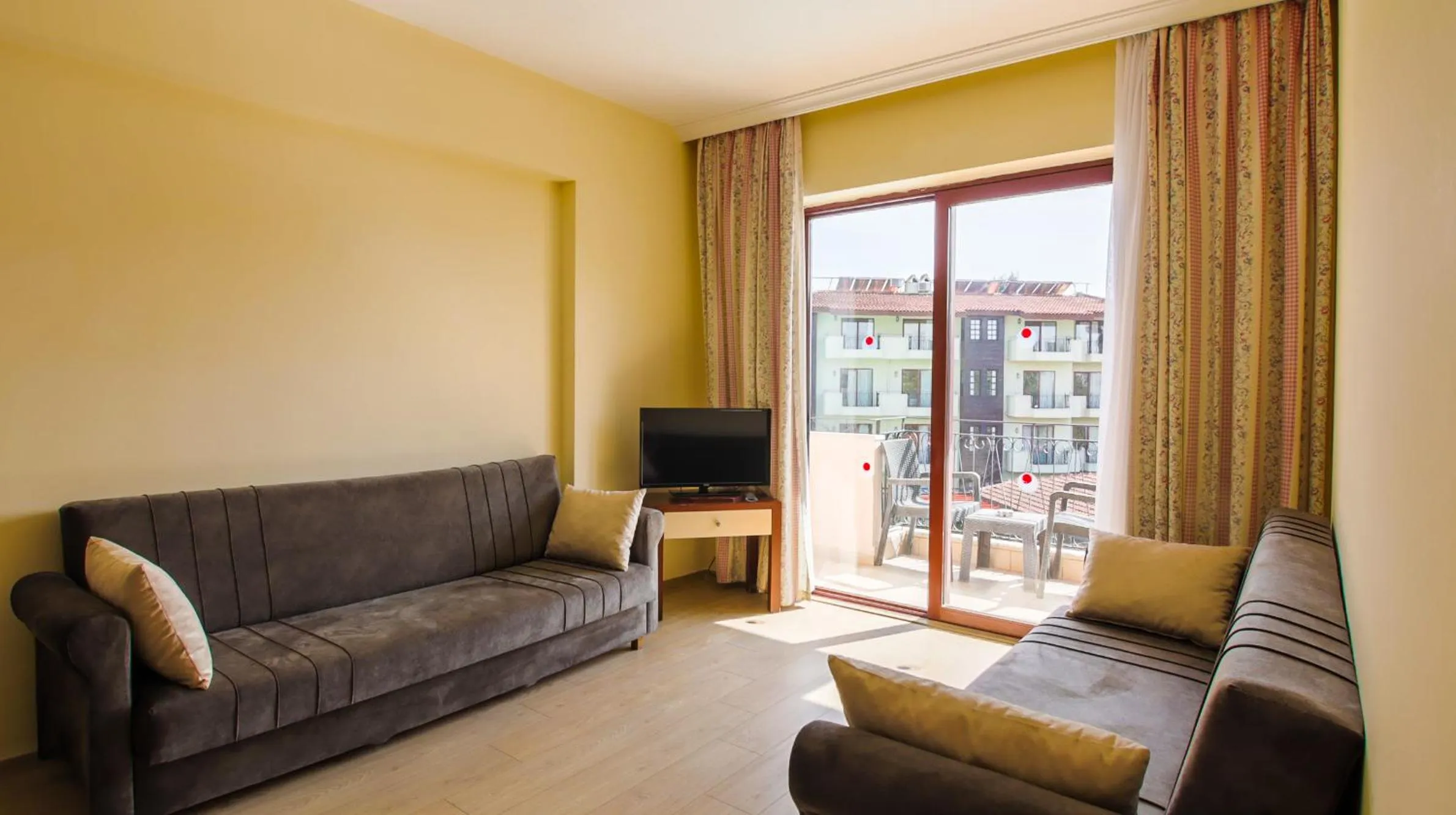 TV and multimedia in LEMAS SUITE HOTEL