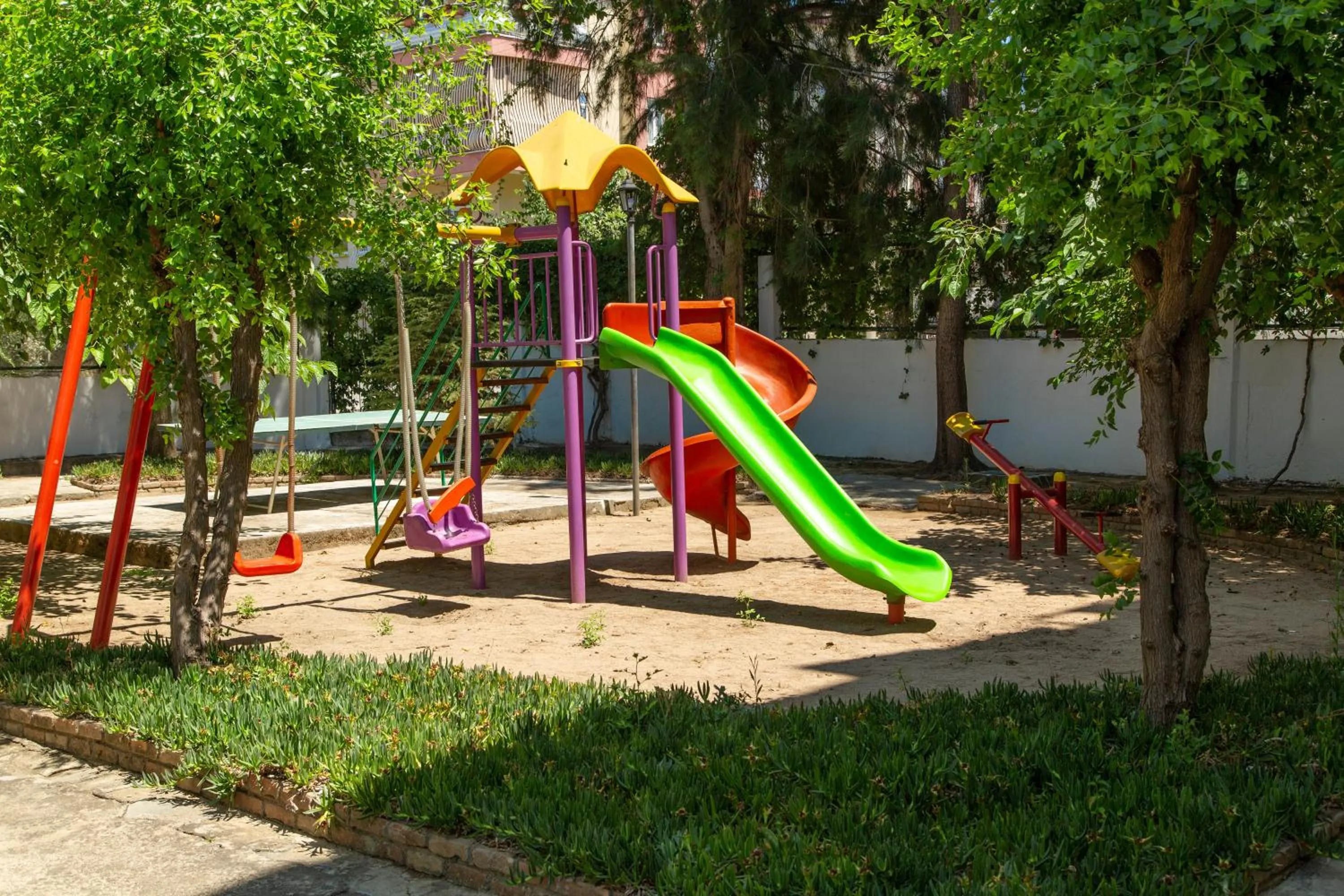 Children play ground in LEMAS SUITE HOTEL