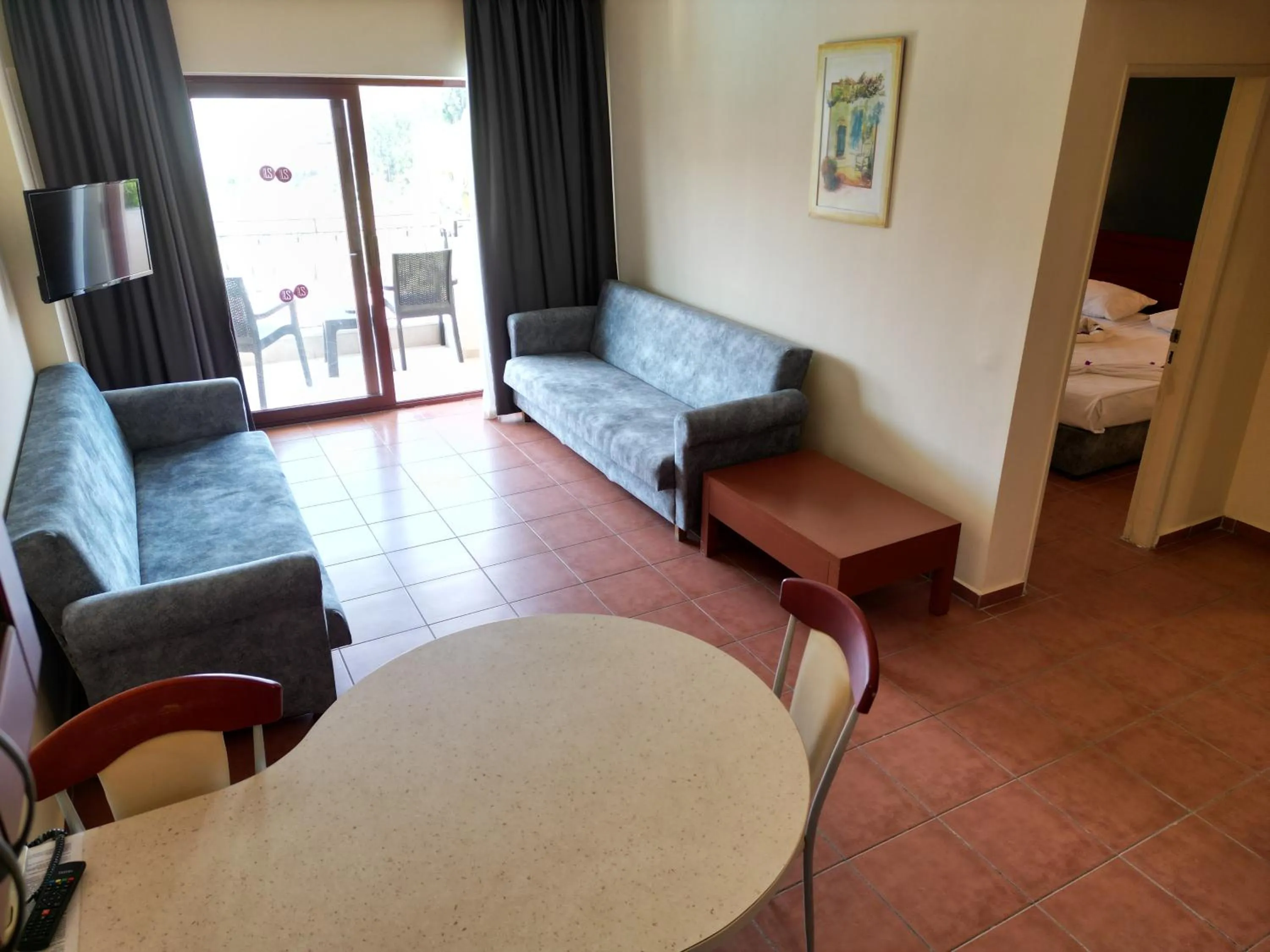 Bed in LEMAS SUITE HOTEL