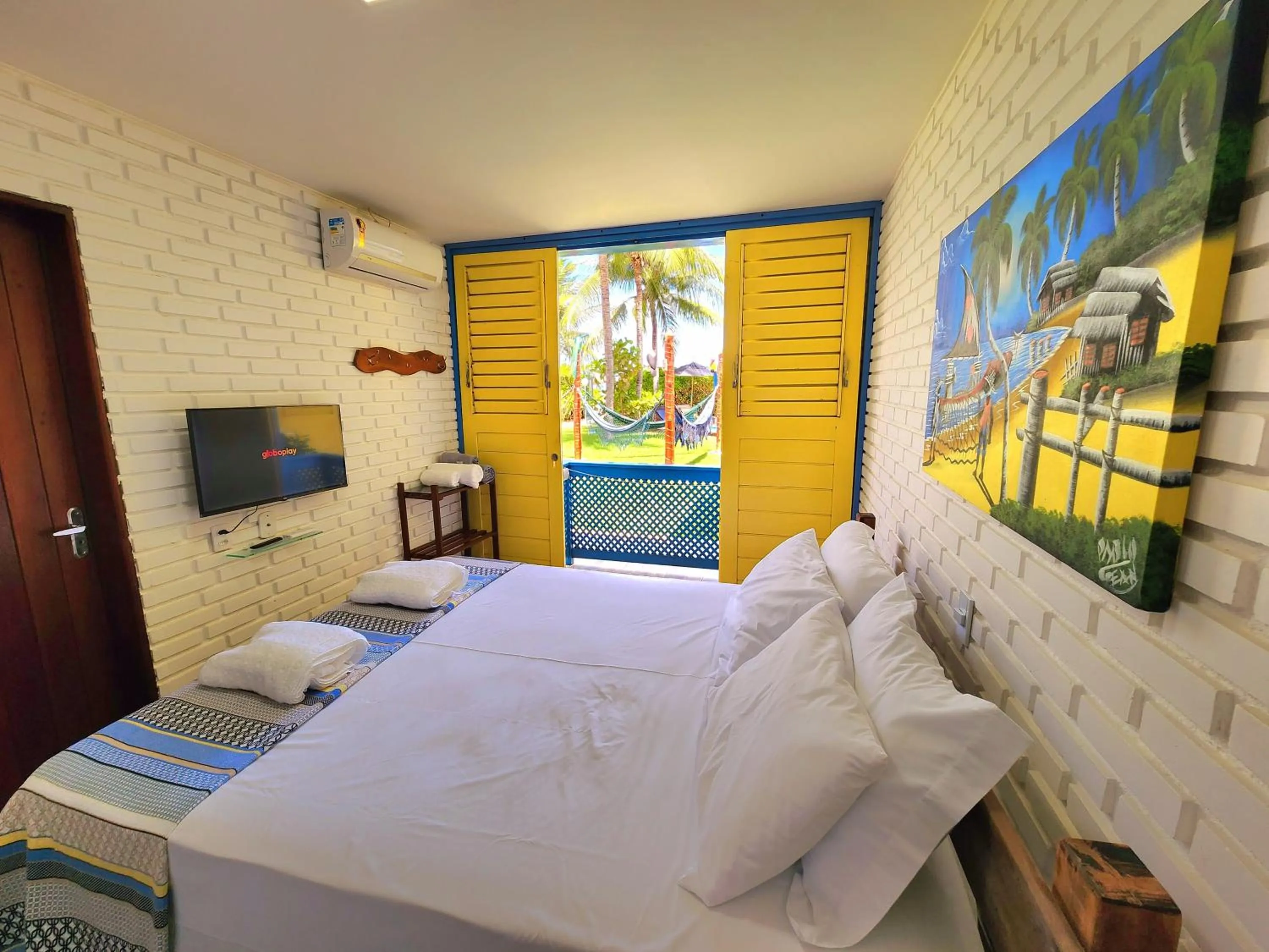 Bed in Manaí Pousada & Beach Club