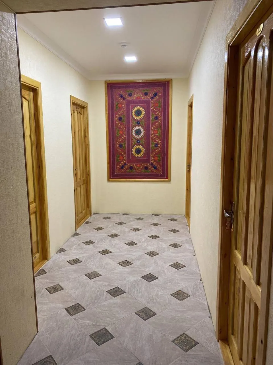 Seating area, Bed in Qamar Hotel