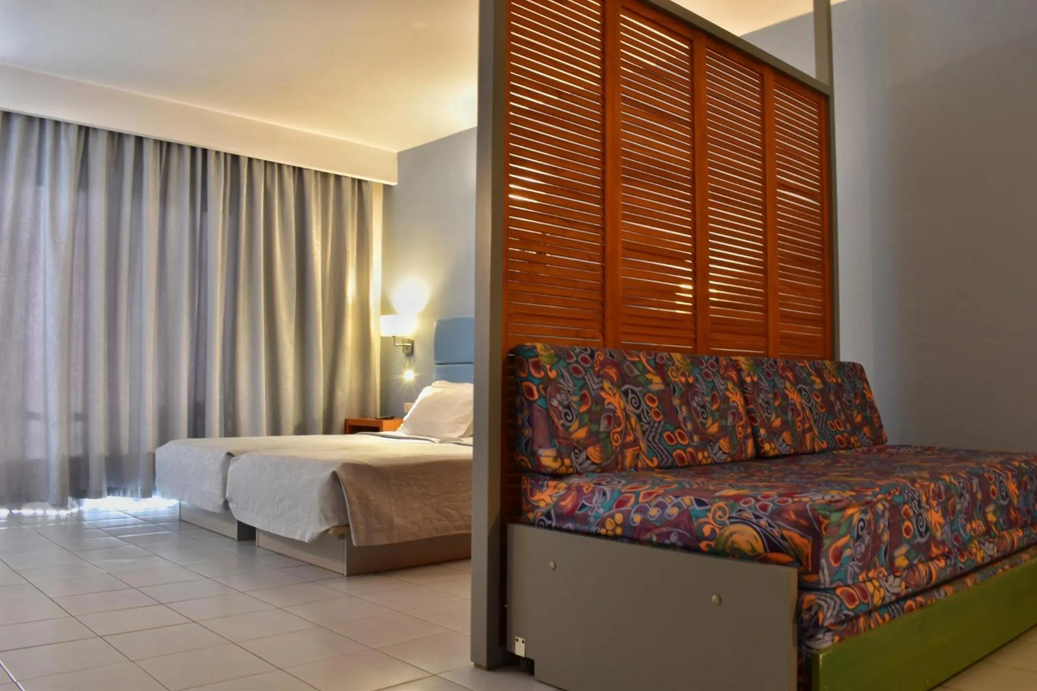 Bed in Caravel Hotel Apartments