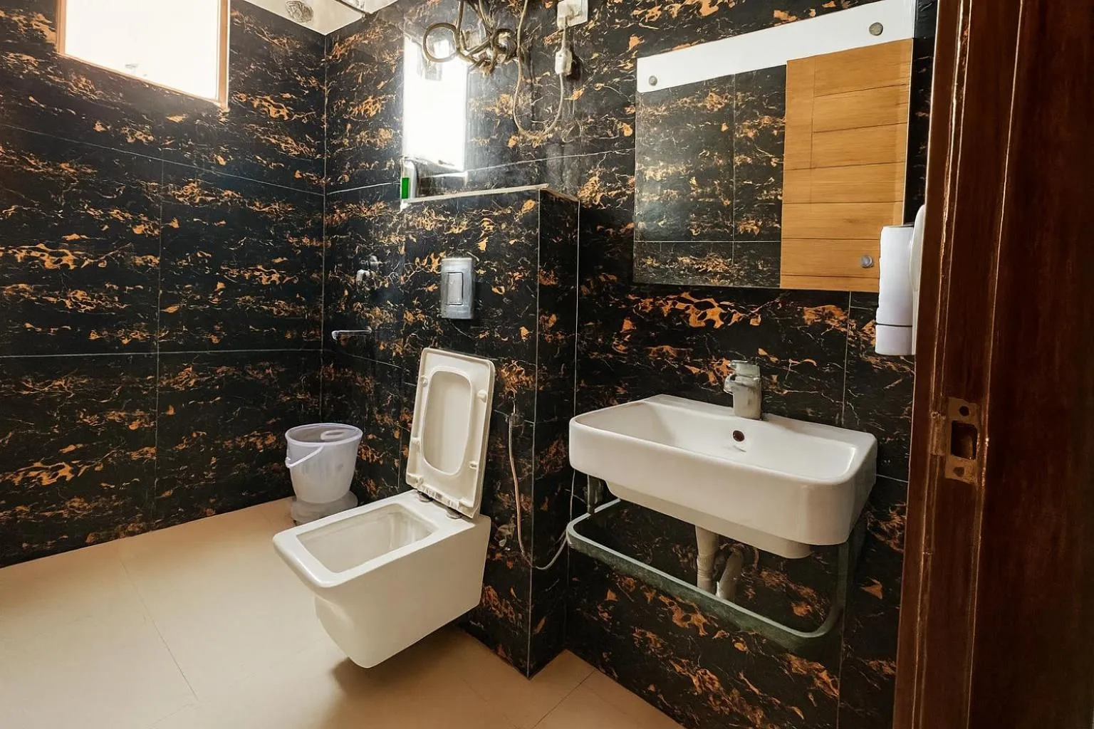 Bathroom in Hotel Good Luck by JMD Group