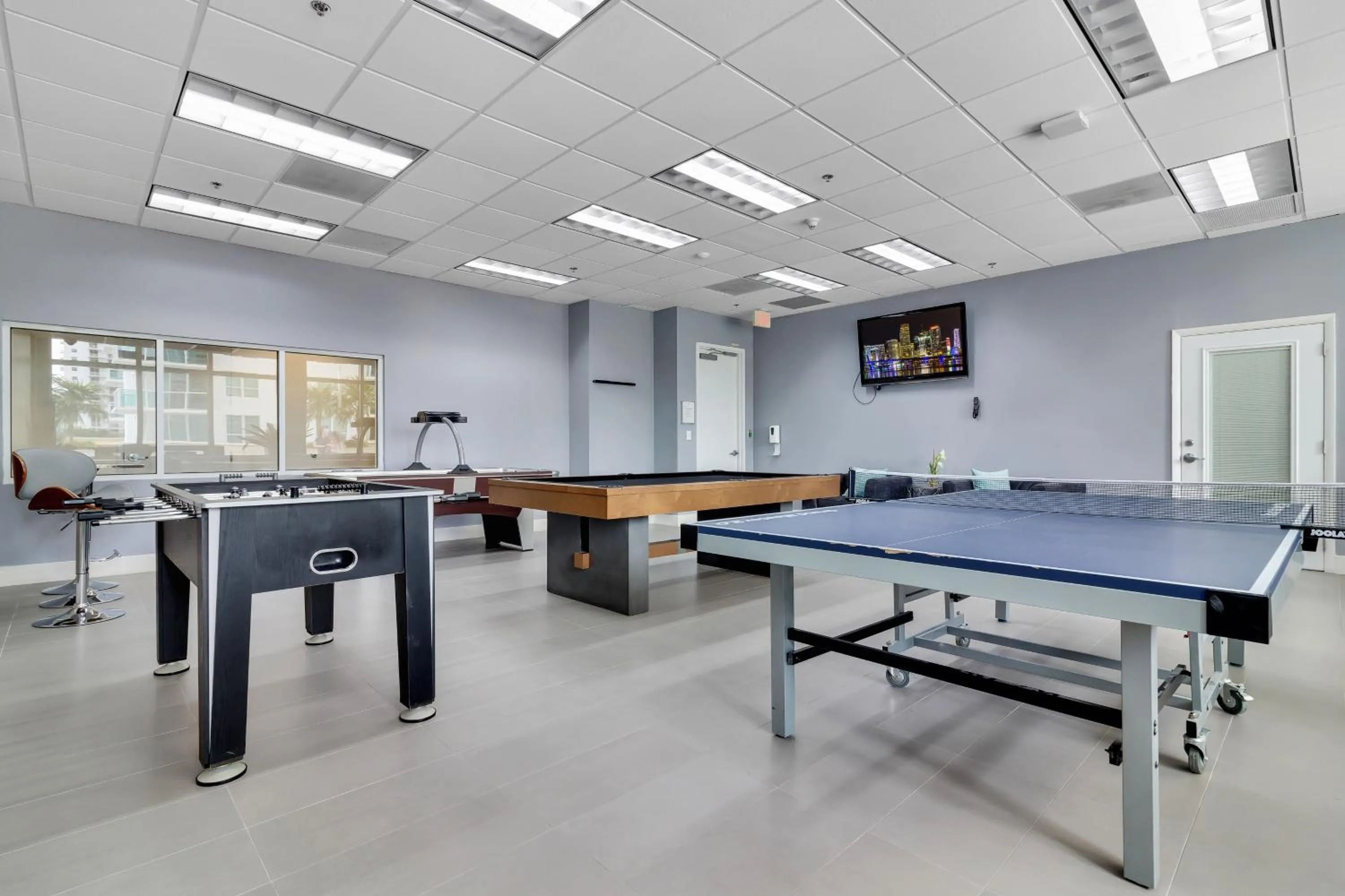 Communal lounge/ TV room in The Club at Brickell Bay Luxury Suites