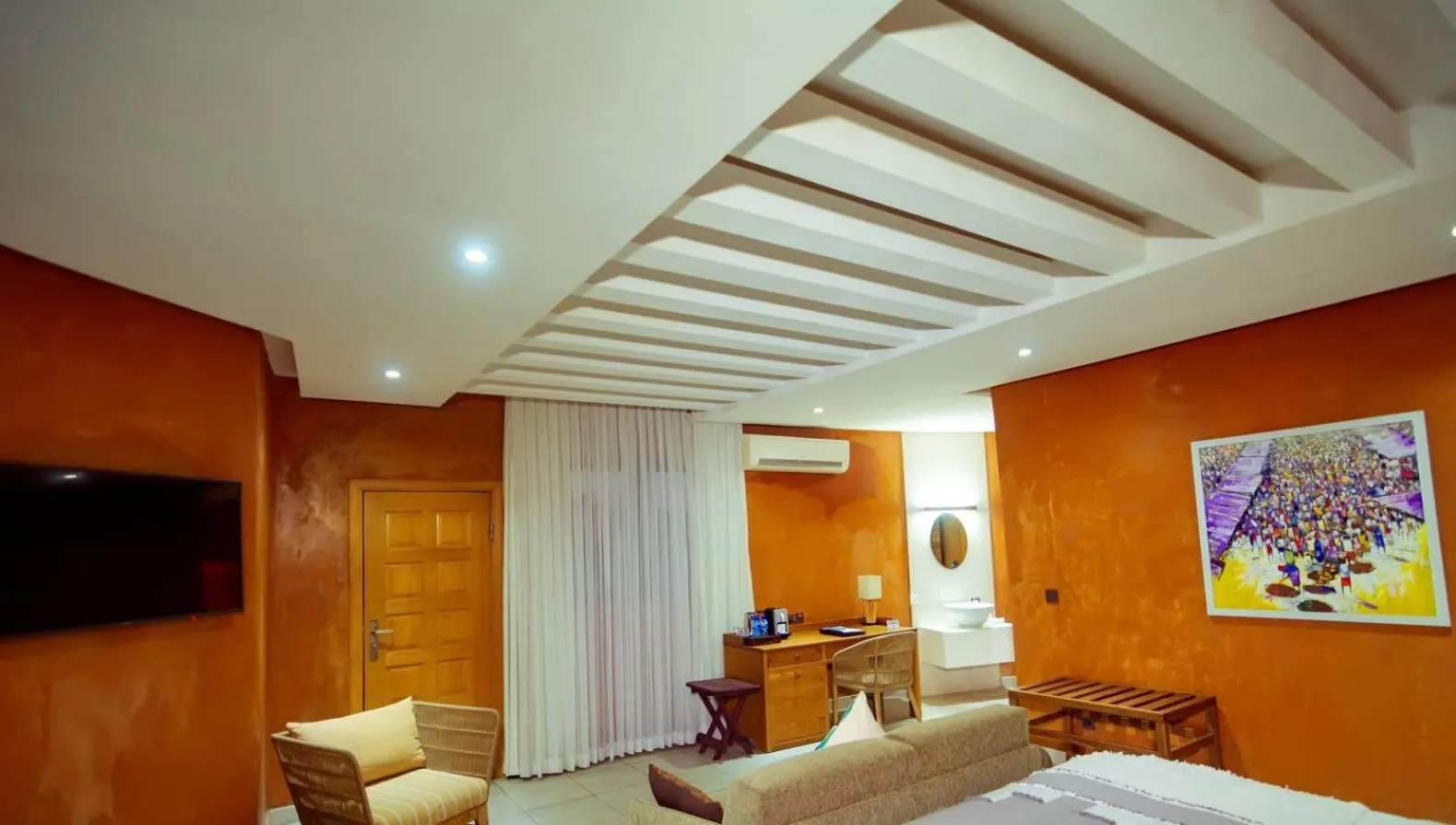 Seating area, Bed in Trois Ore Residences & Green Earth Bistro