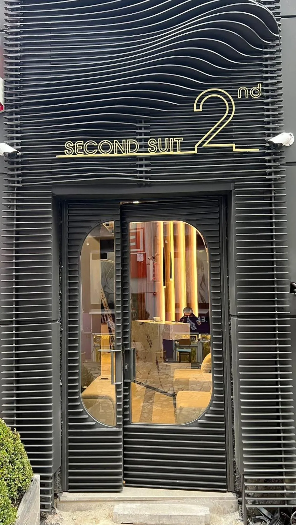 Property logo or sign in Second Suit Hotel