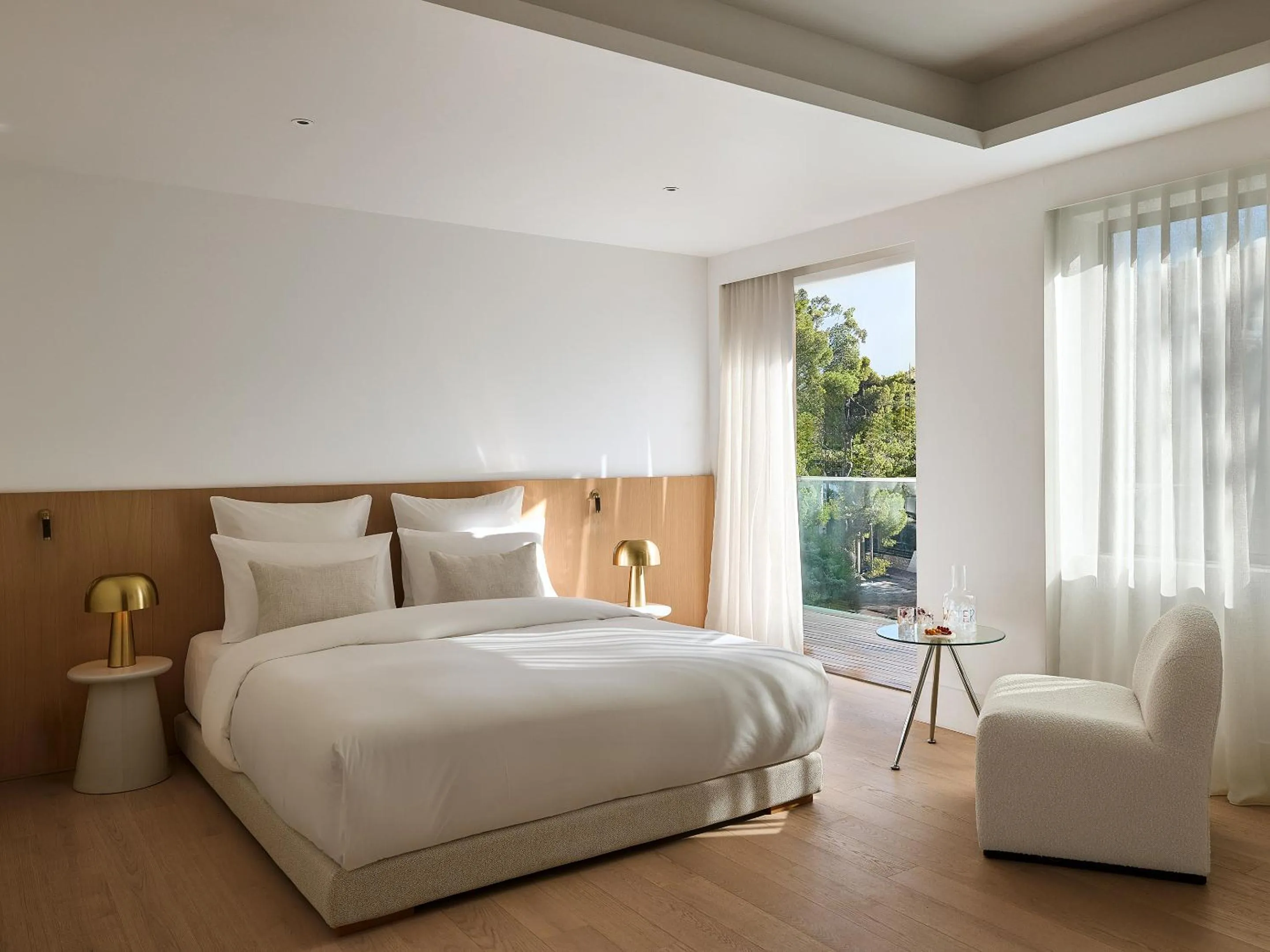 Bed in Vouliagmeni Suites