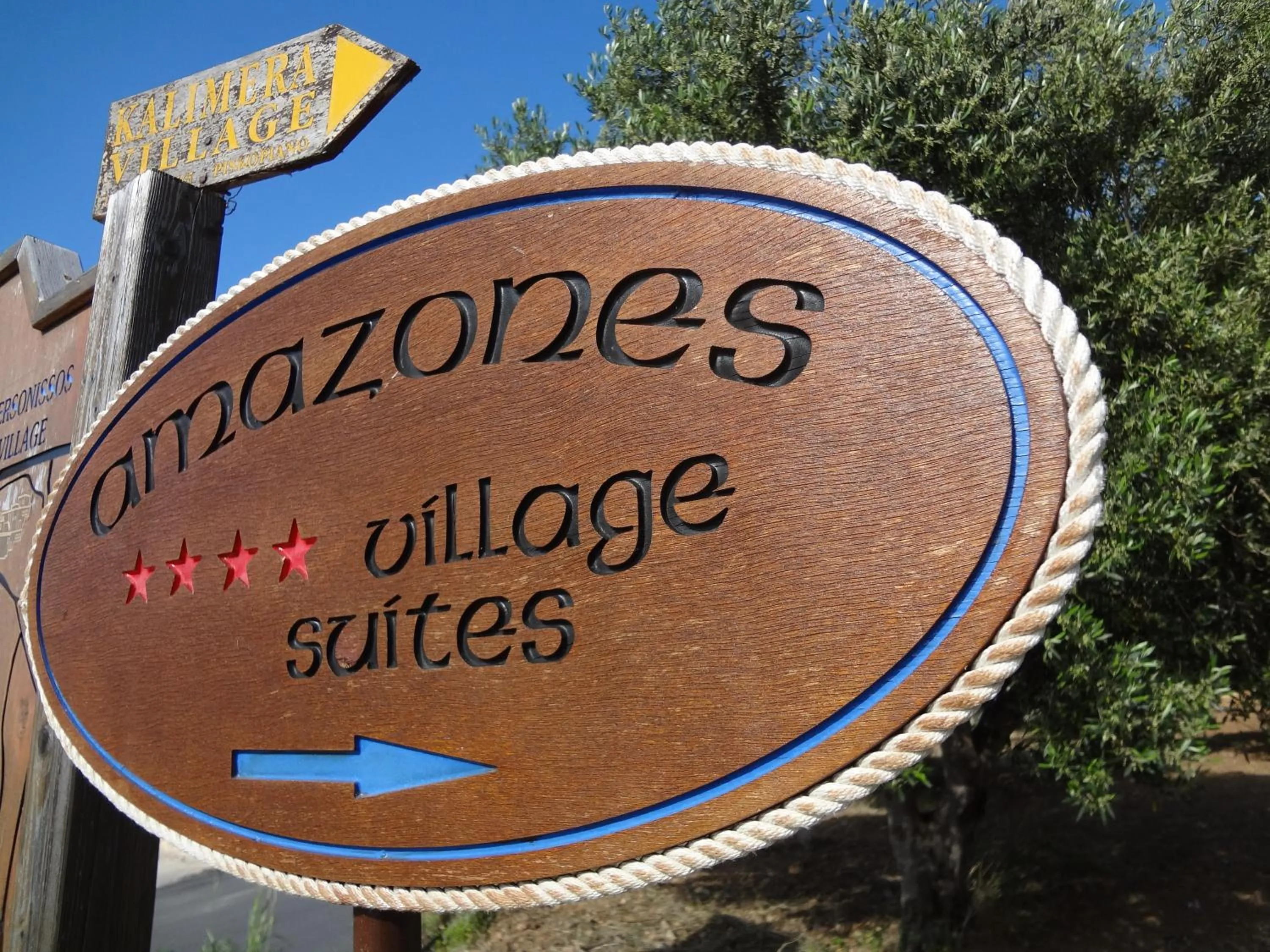 Property logo or sign in Amazones Village Suites