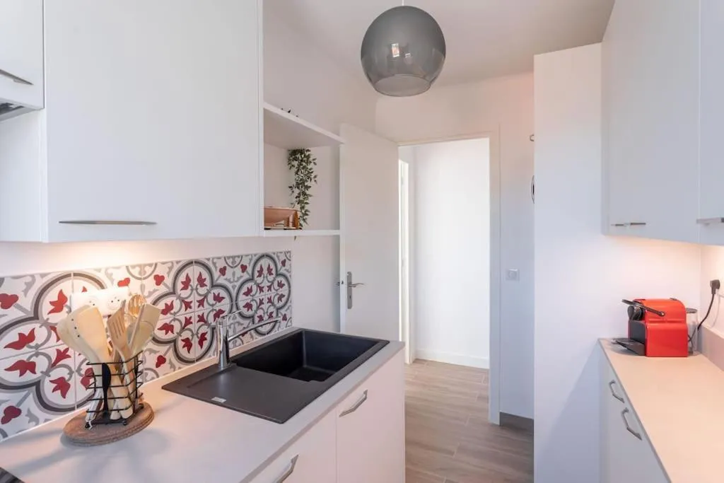 Kitchen or kitchenette in Apartment With Panoramic Sea View, Walk To The Beach - Maréchal Juin by Halldis