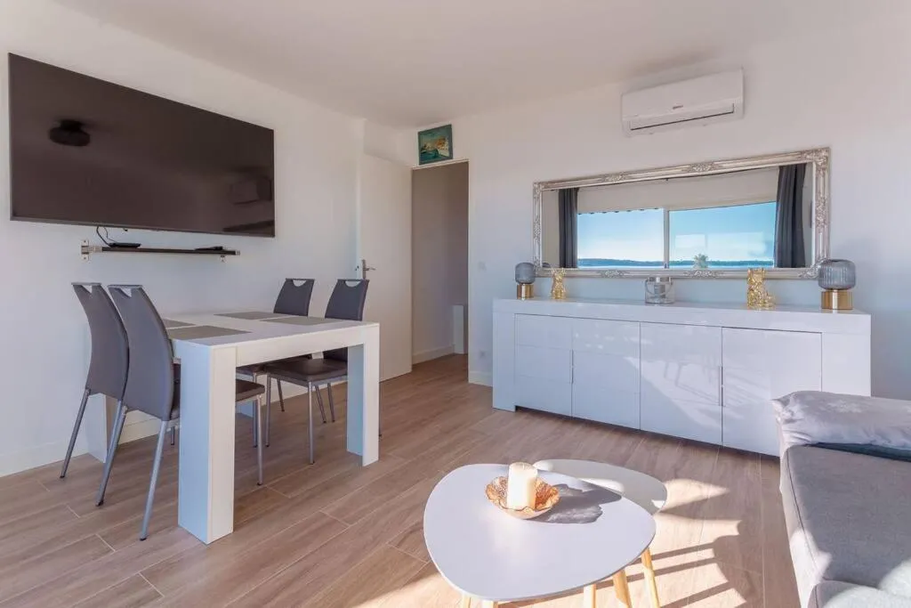 Living room in Apartment With Panoramic Sea View, Walk To The Beach - Maréchal Juin by Halldis
