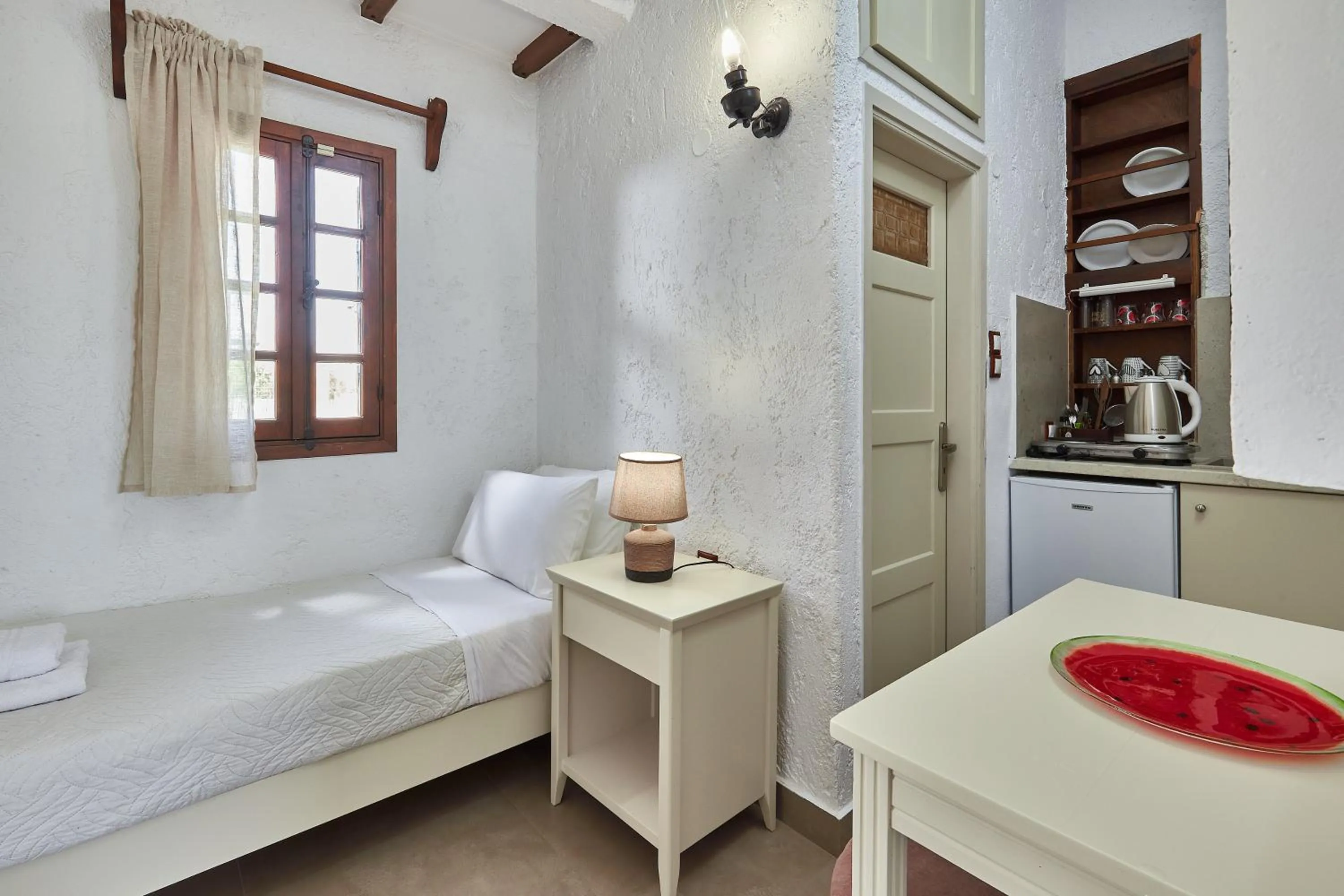 Bed in Mila Malia Studios Hotel