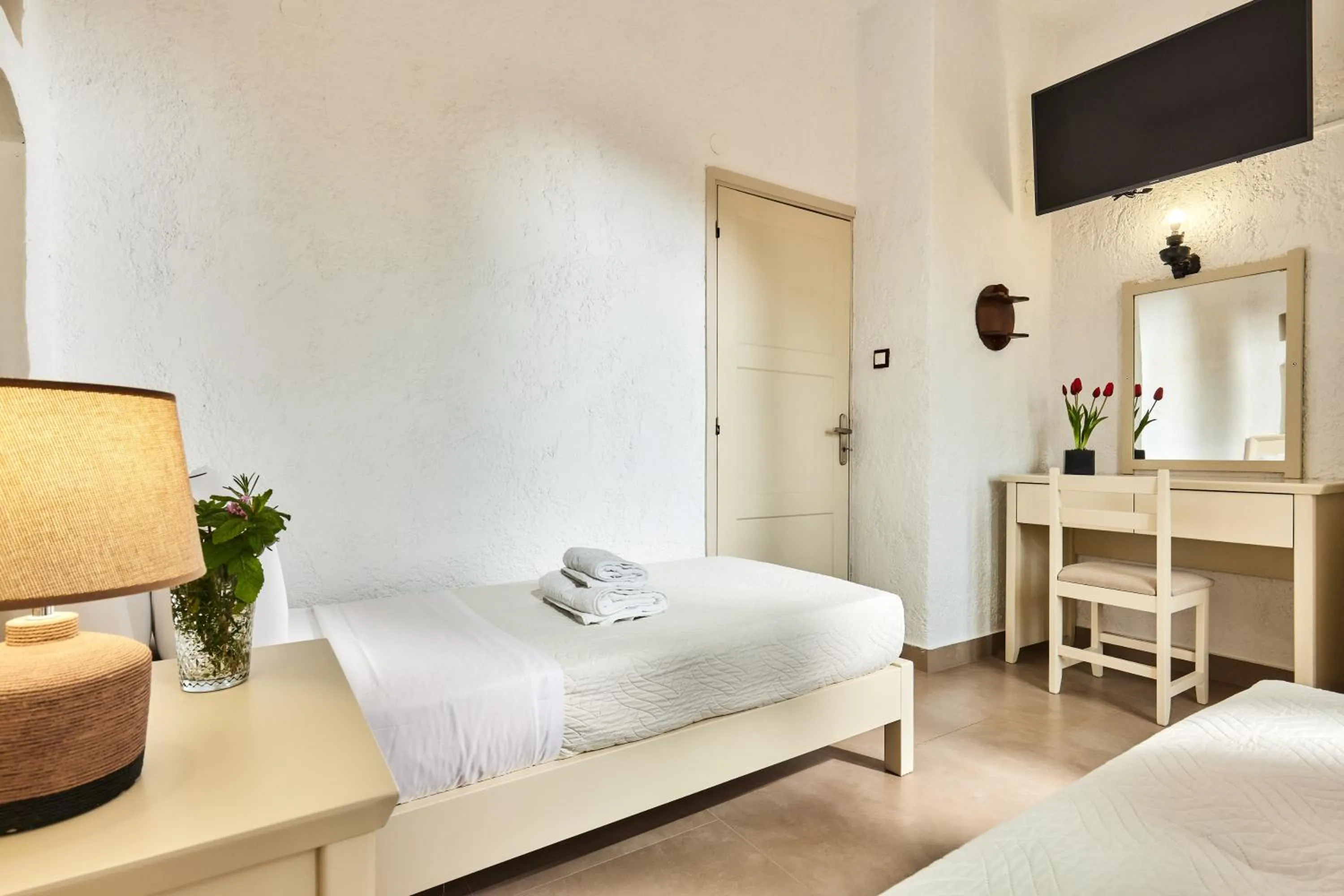 Bed in Mila Malia Studios Hotel