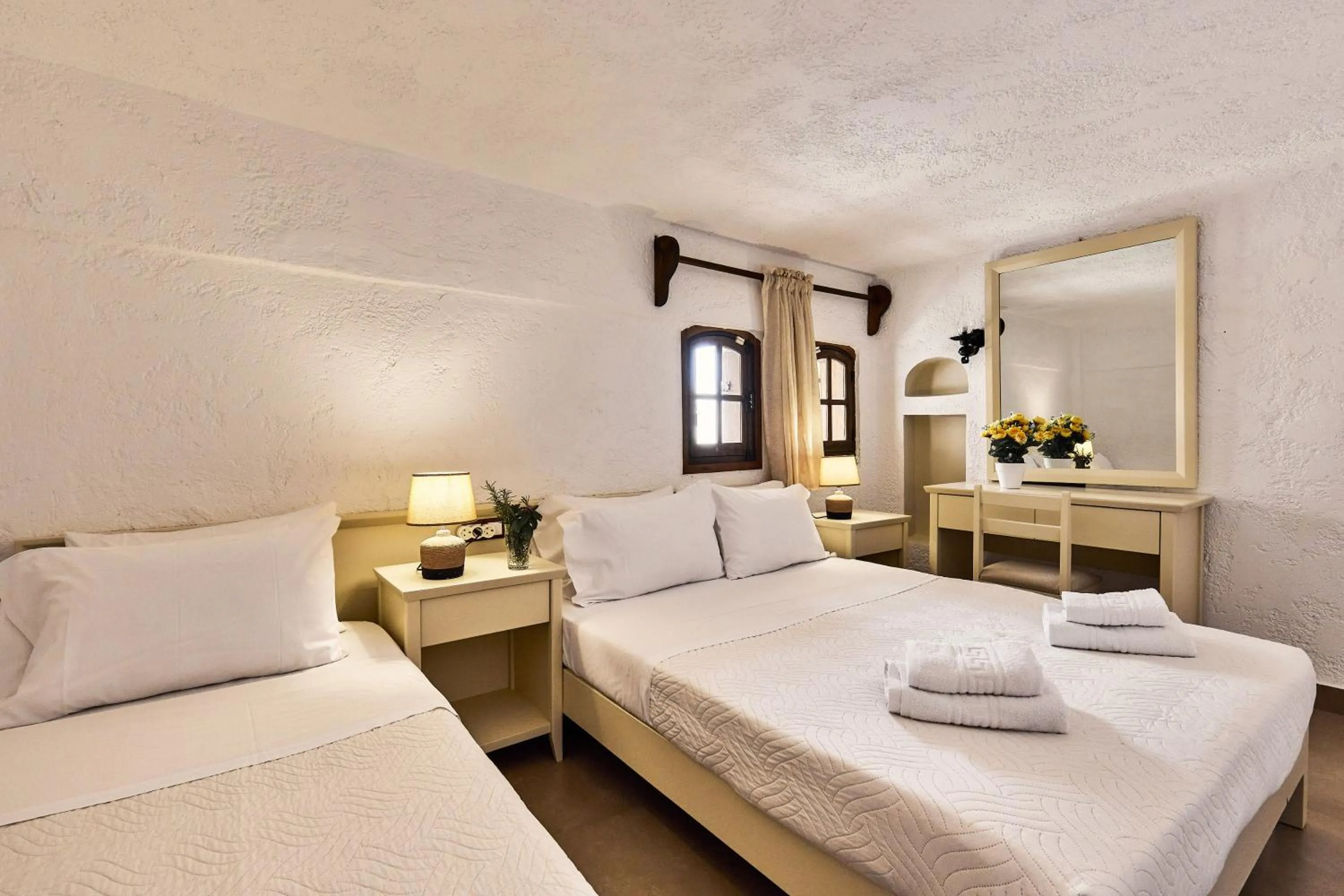 Bed in Mila Malia Studios Hotel