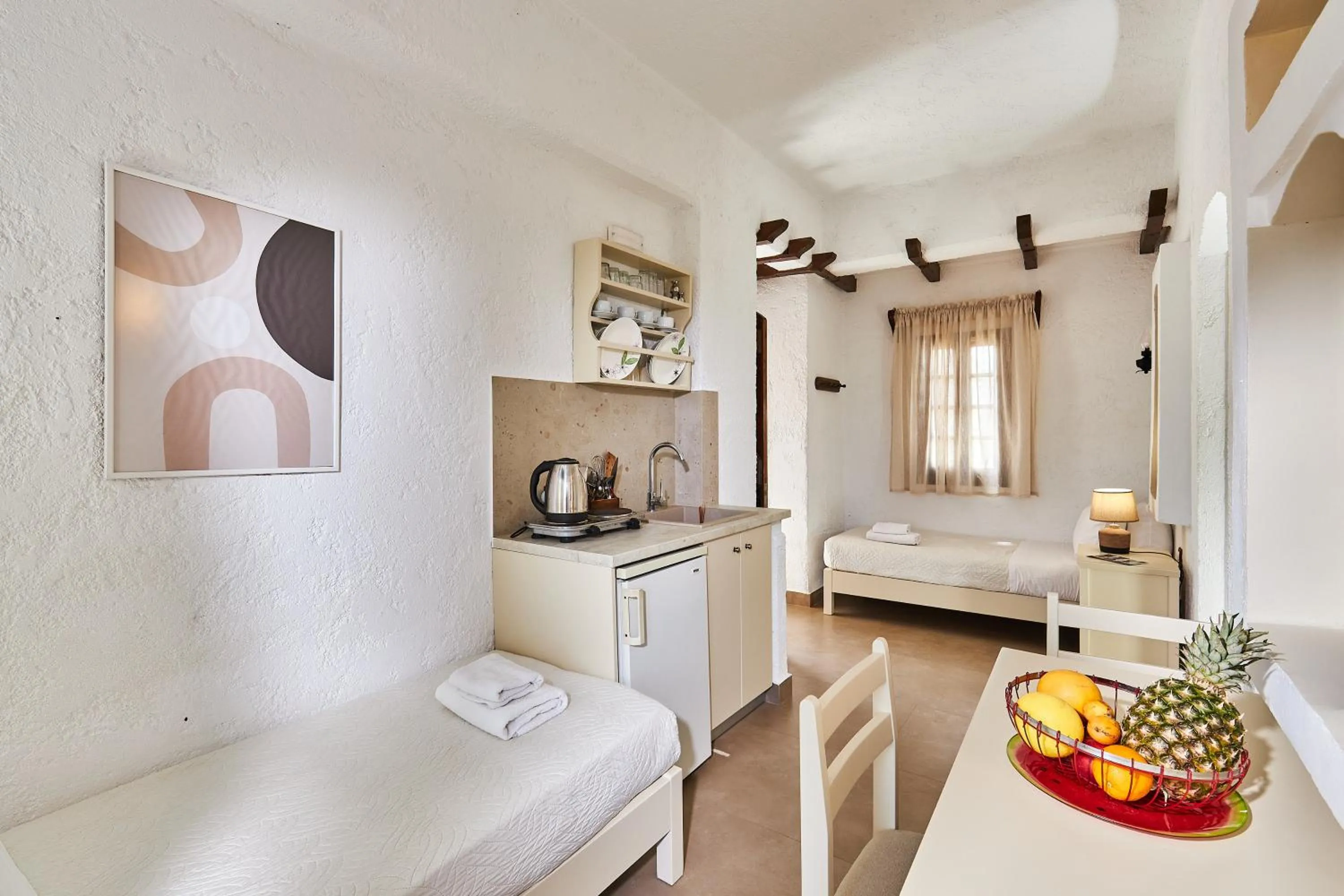 Bed in Mila Malia Studios Hotel