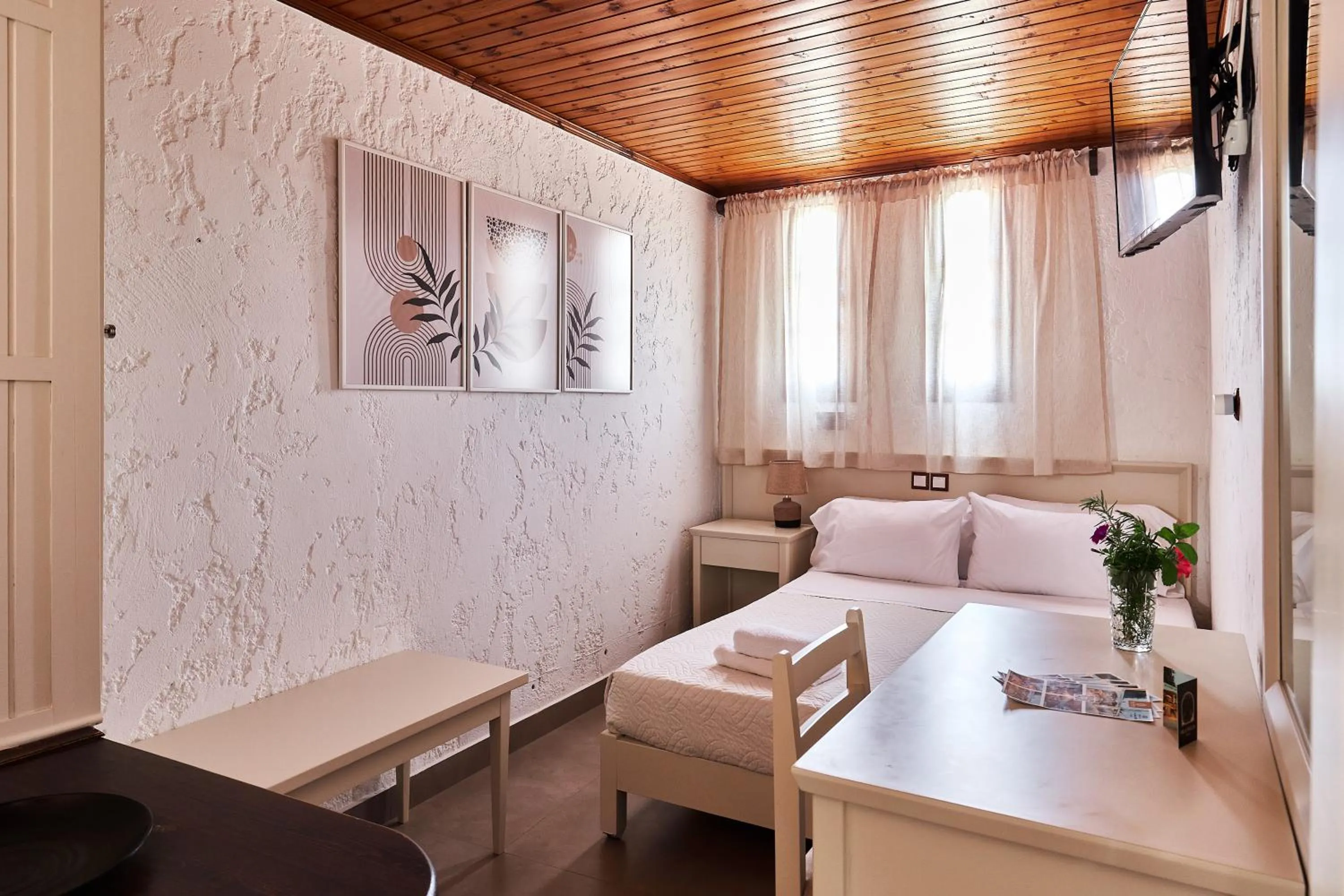 Bed in Mila Malia Studios Hotel