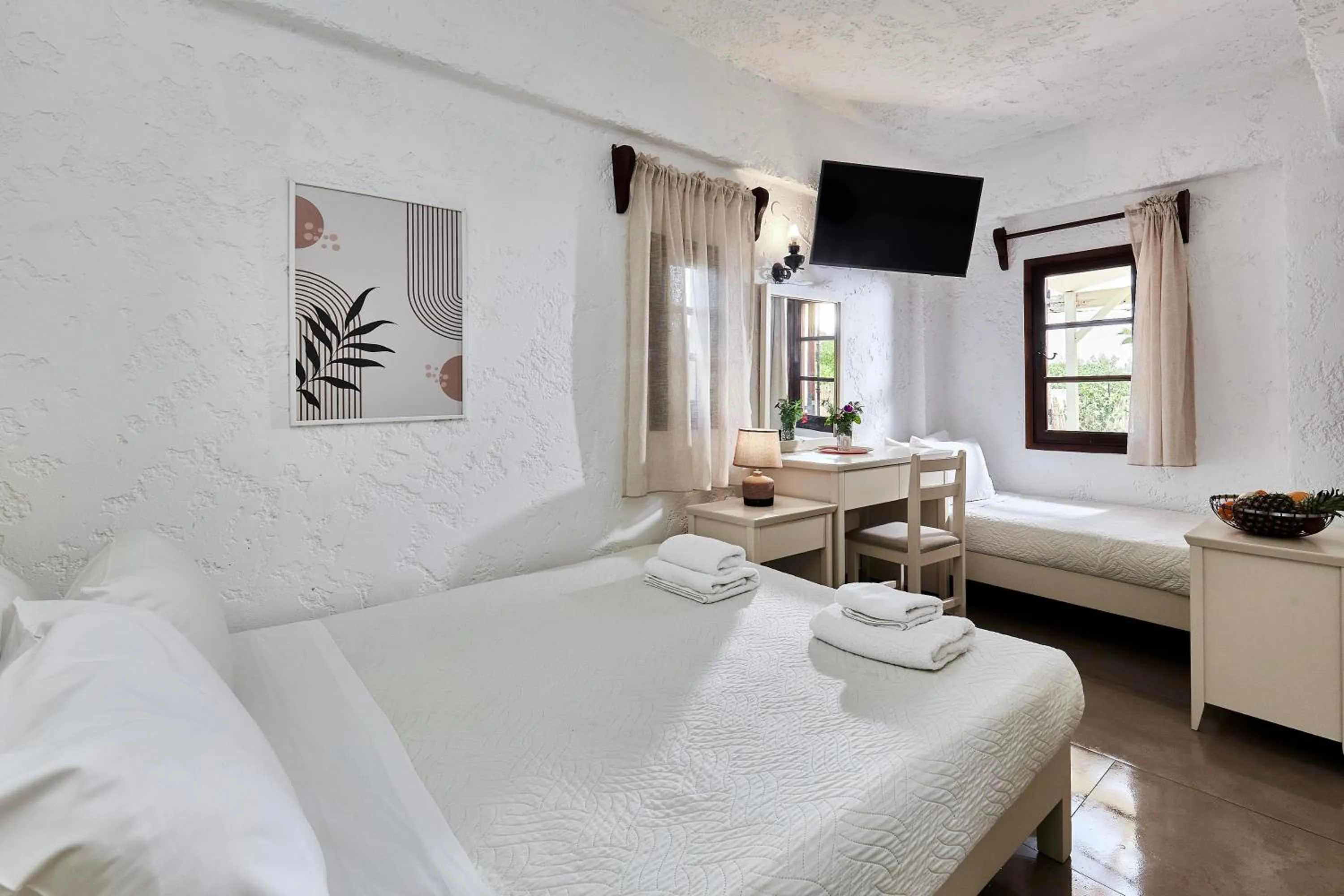 Bed in Mila Malia Studios Hotel